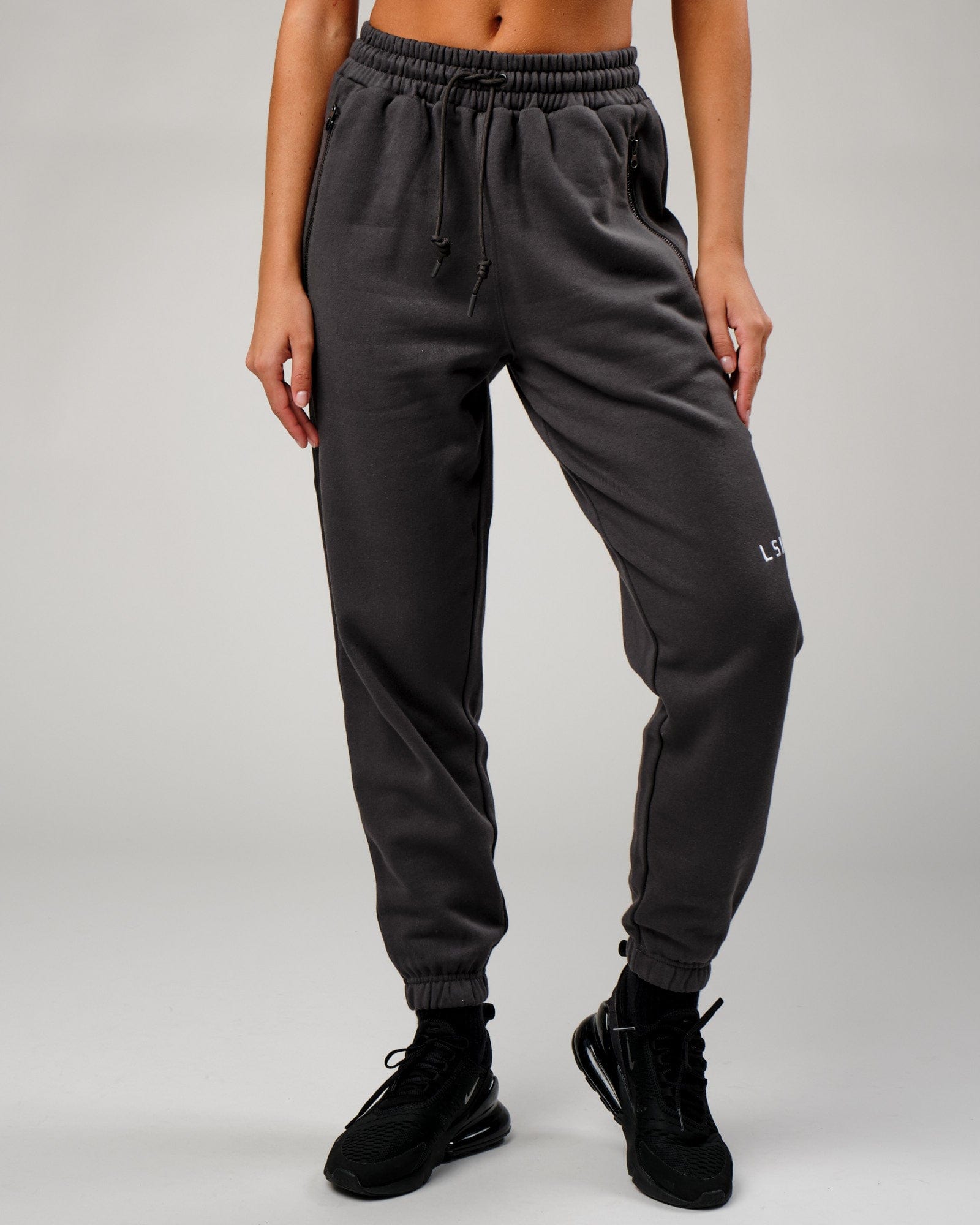 Model wearing Becca Track Pant - Phantom