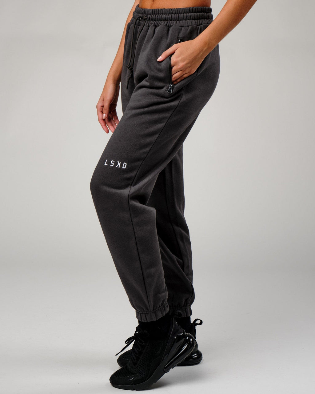 Model wearing Becca Track Pant - Phantom