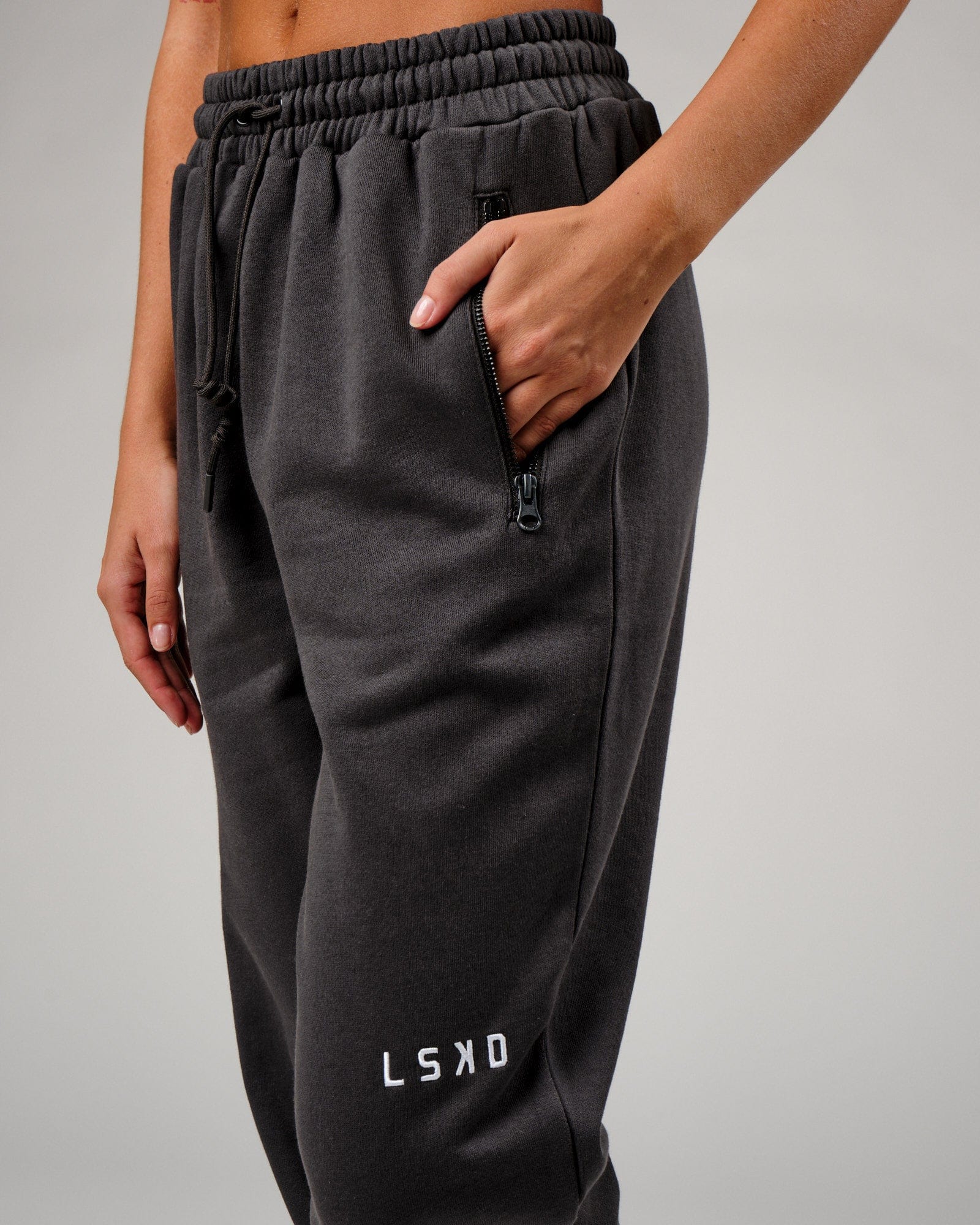 Model wearing Becca Track Pant - Phantom