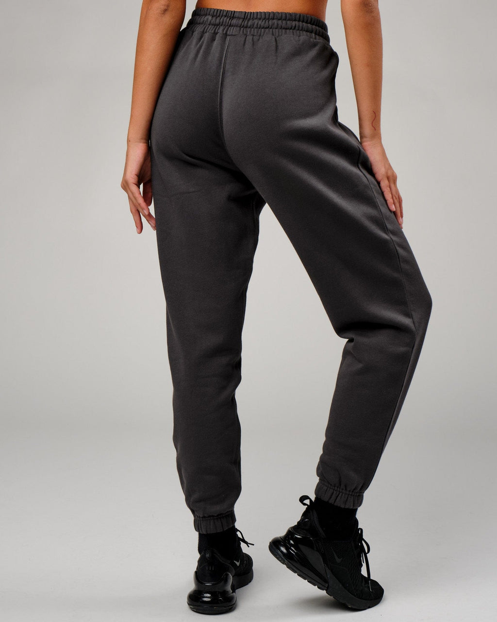 Model wearing Becca Track Pant - Phantom