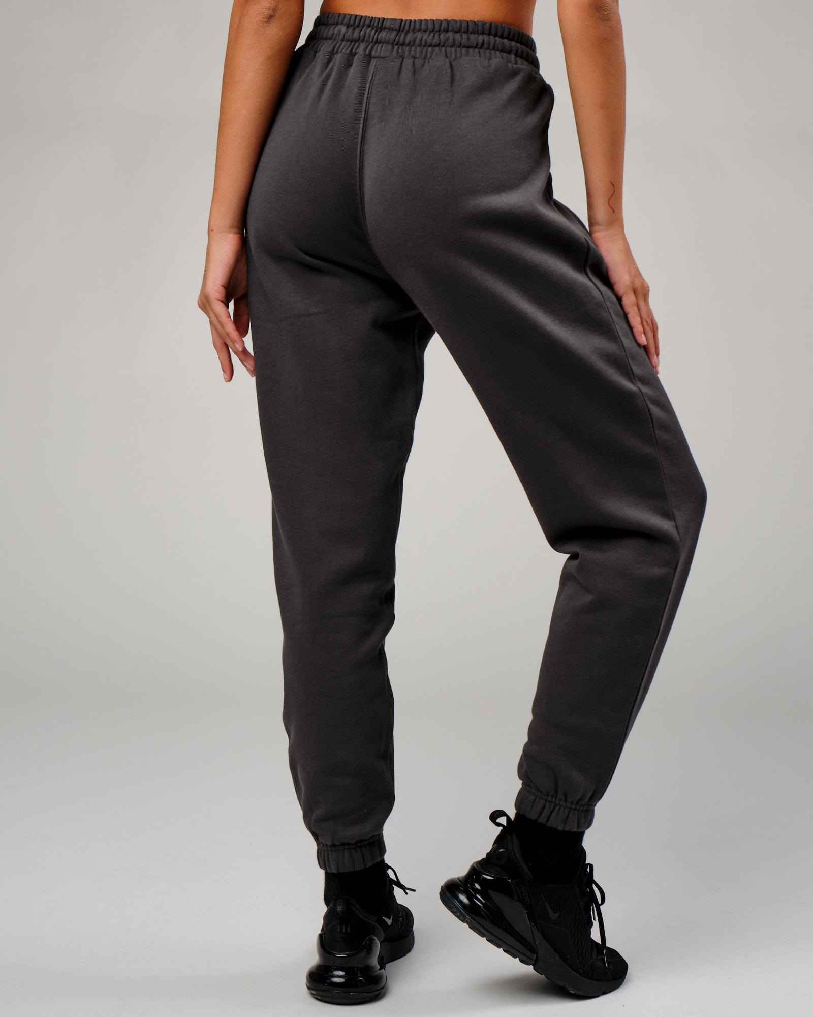 Model wearing Becca Track Pant - Phantom