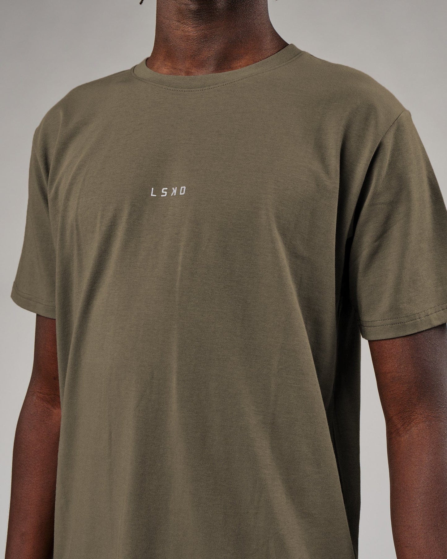 Model wearing Base Tee - Walnut Grey