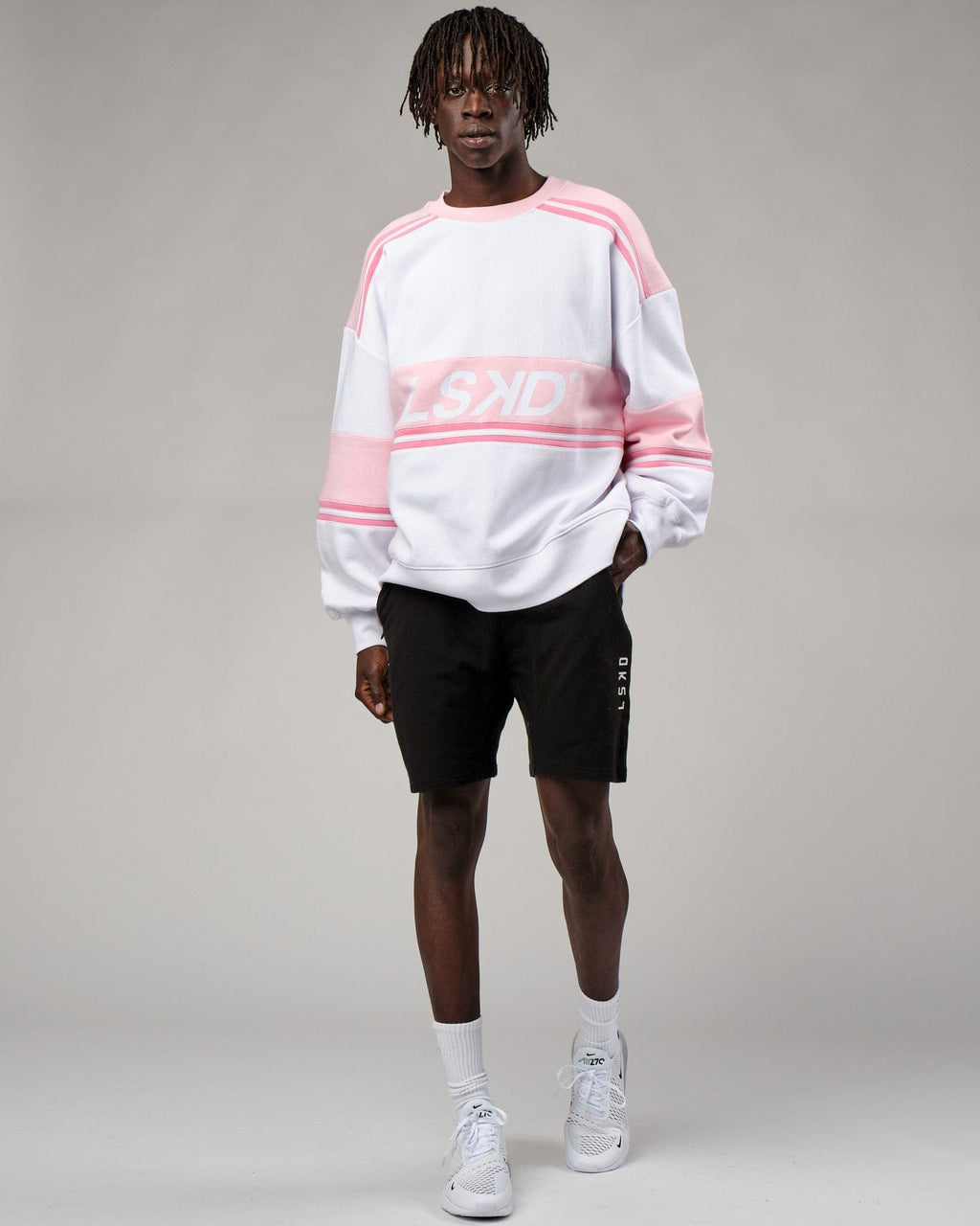 Model wearing Unisex A-Team Sweater Oversize - Petal Pink-White