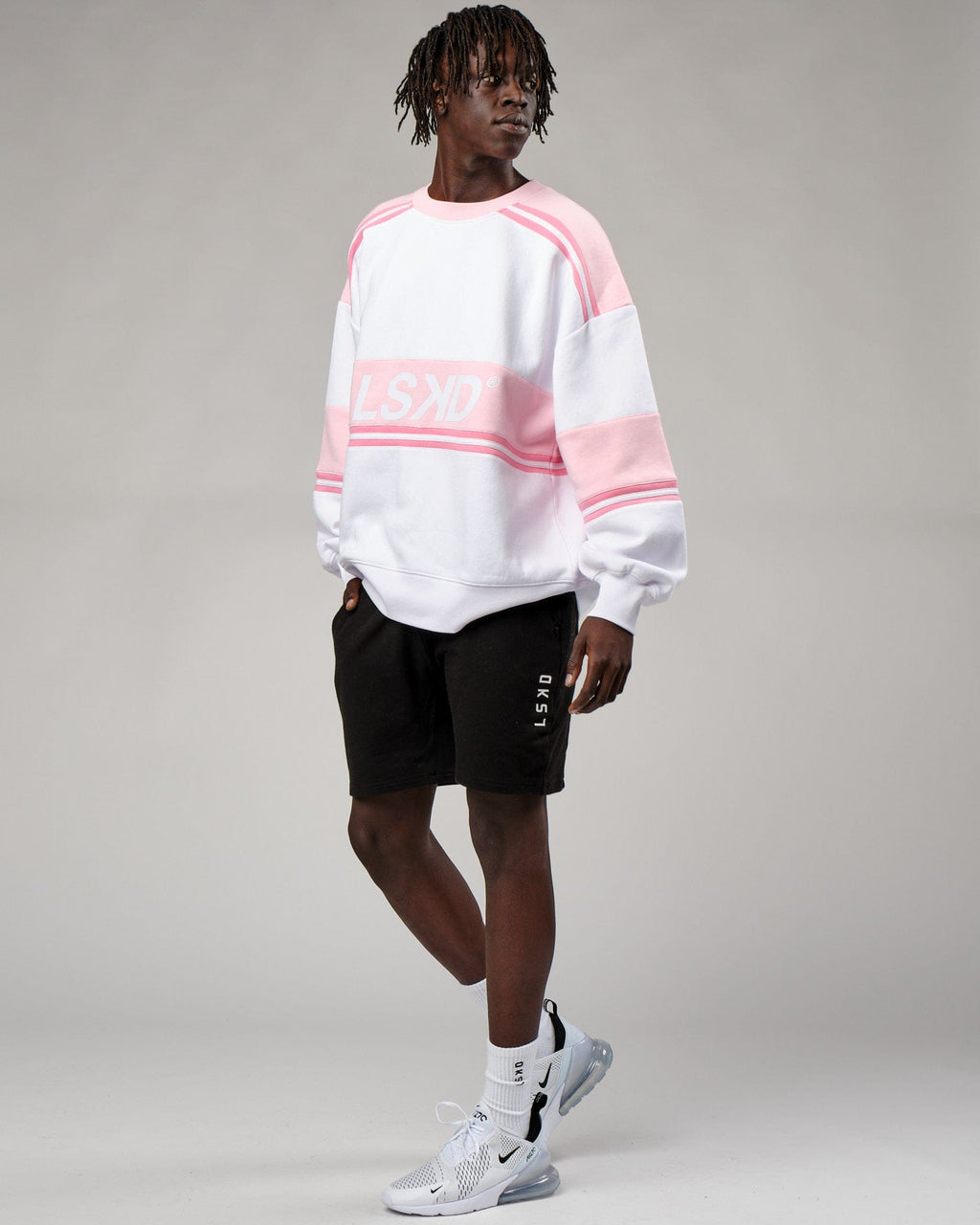 Model wearing Unisex A-Team Sweater Oversize - Petal Pink-White