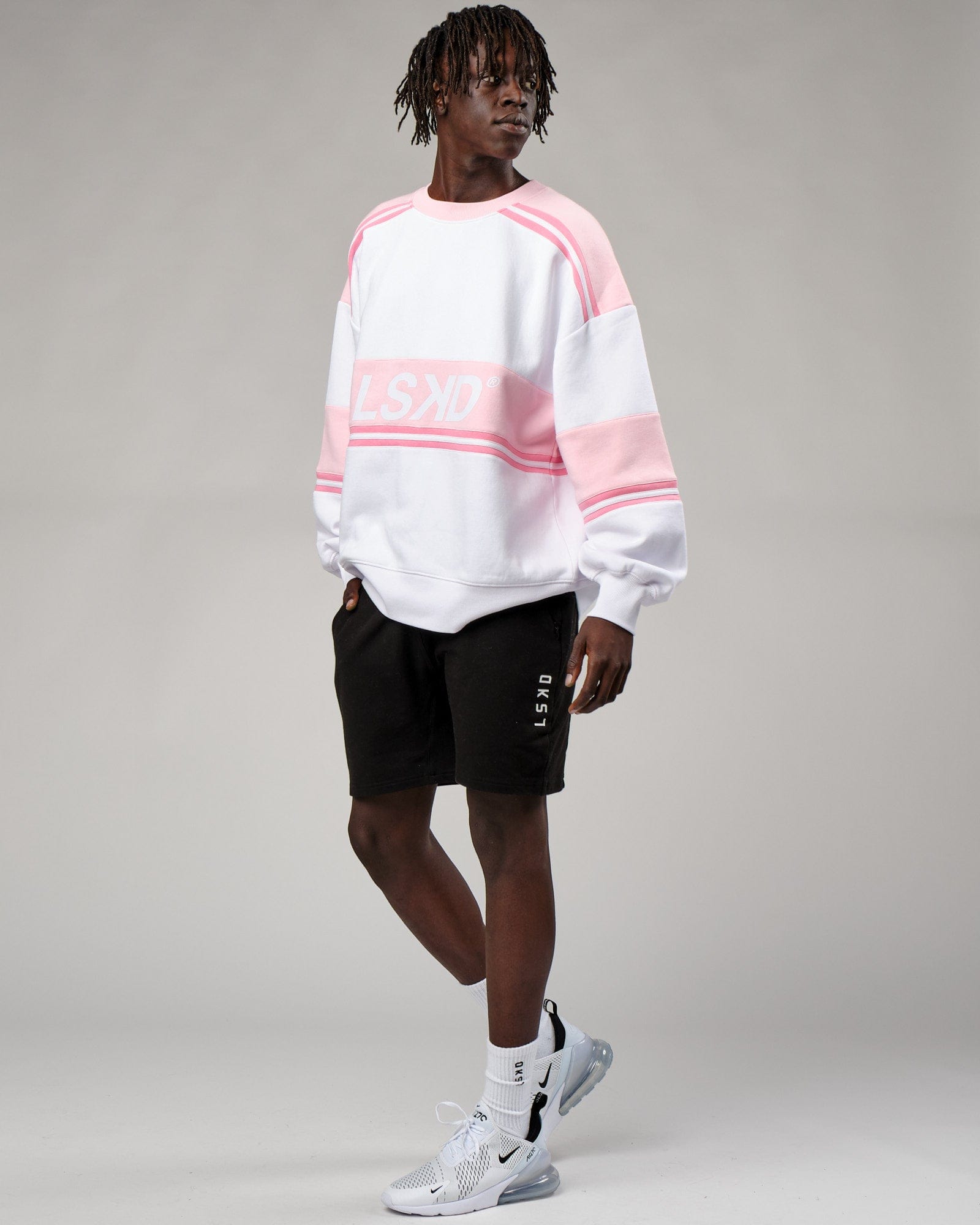 Model wearing Unisex A-Team Sweater Oversize - Petal Pink-White