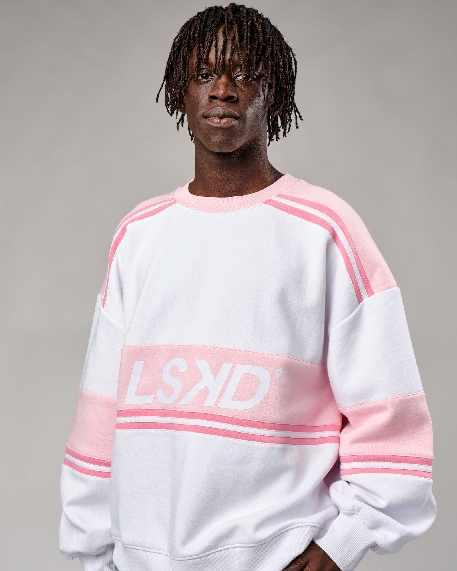 Model wearing Unisex A-Team Sweater Oversize - Petal Pink-White