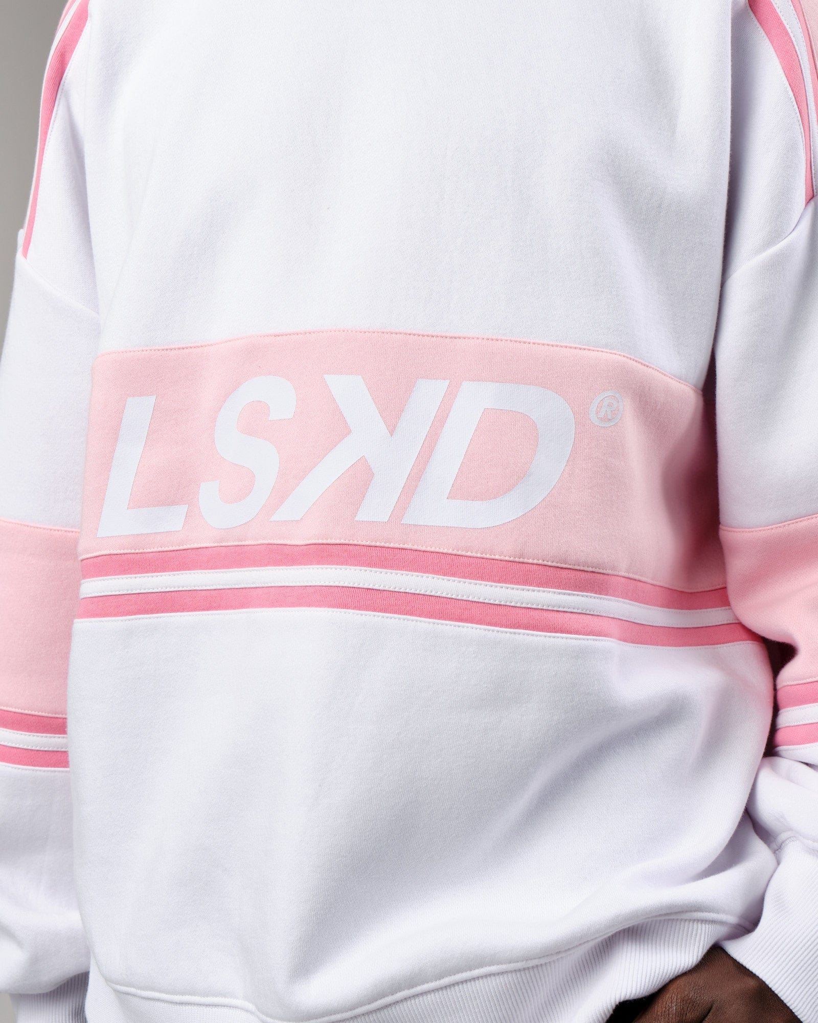 Model wearing Unisex A-Team Sweater Oversize - Petal Pink-White