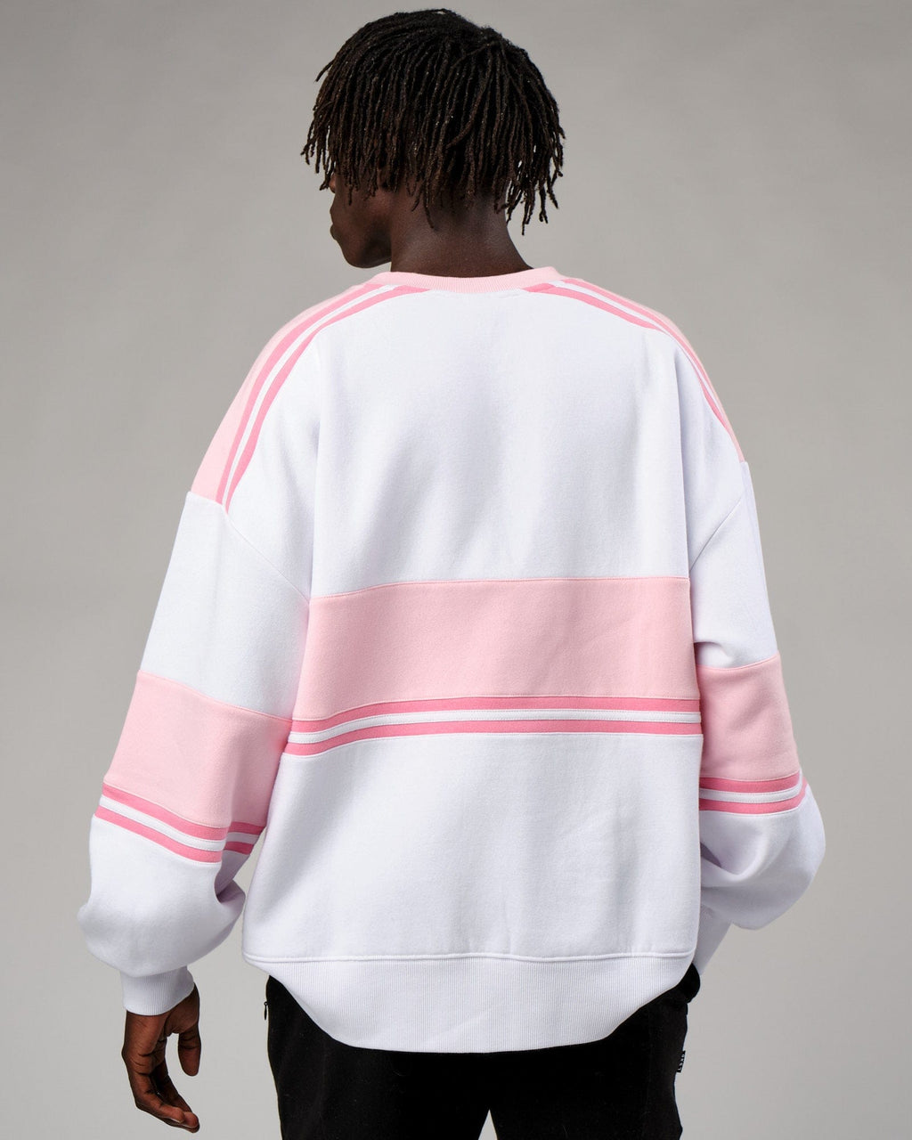 Model wearing Unisex A-Team Sweater Oversize - Petal Pink-White