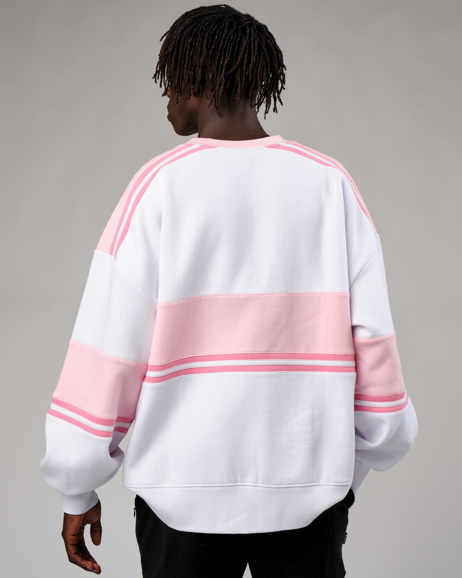 Model wearing Unisex A-Team Sweater Oversize - Petal Pink-White