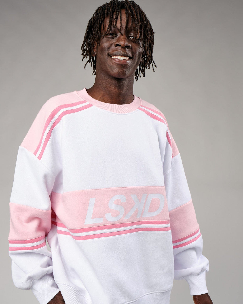 Model wearing Unisex A-Team Sweater Oversize - Petal Pink-White