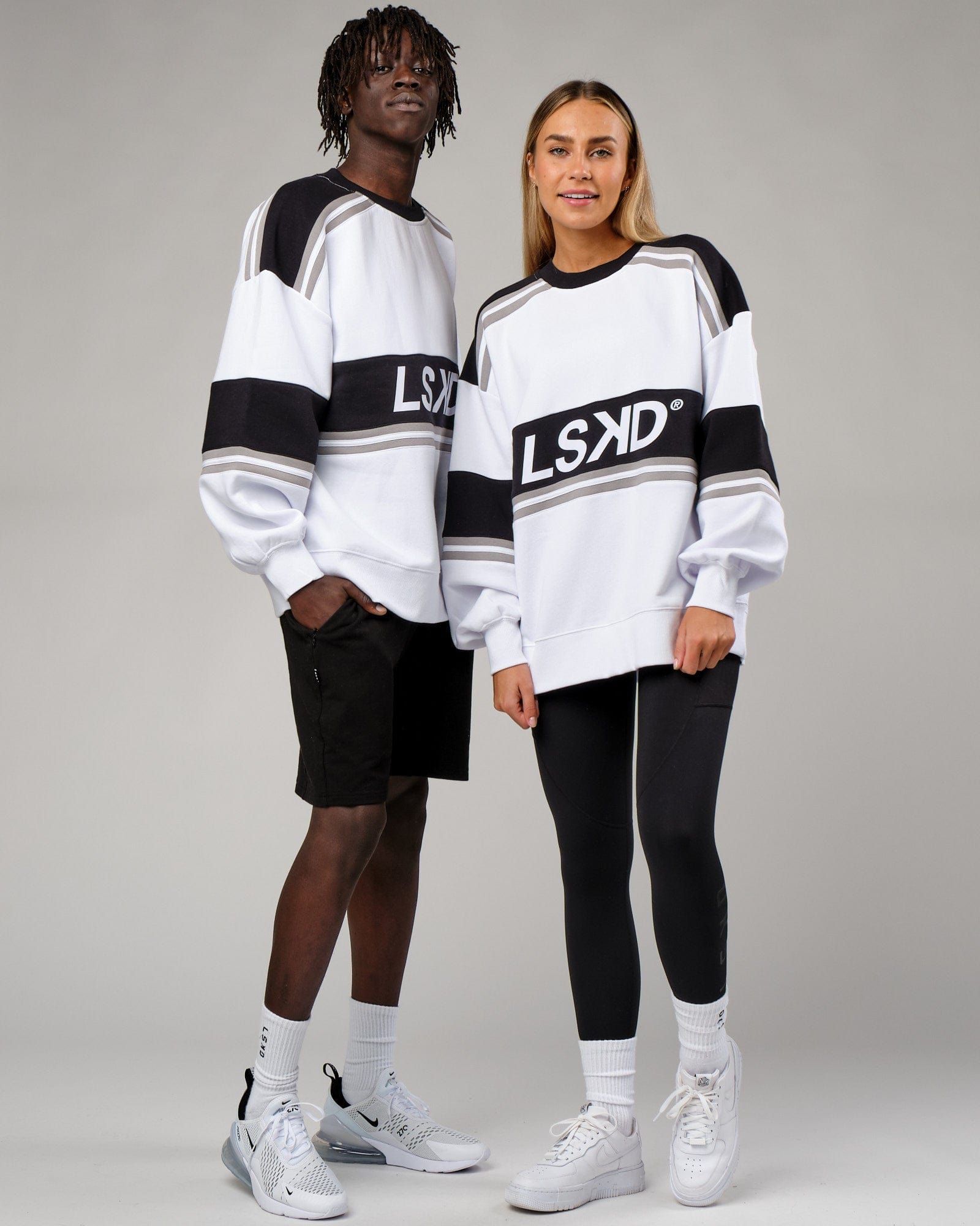 Model wearing Unisex A-Team Sweater Oversize - White-Black-Alloy