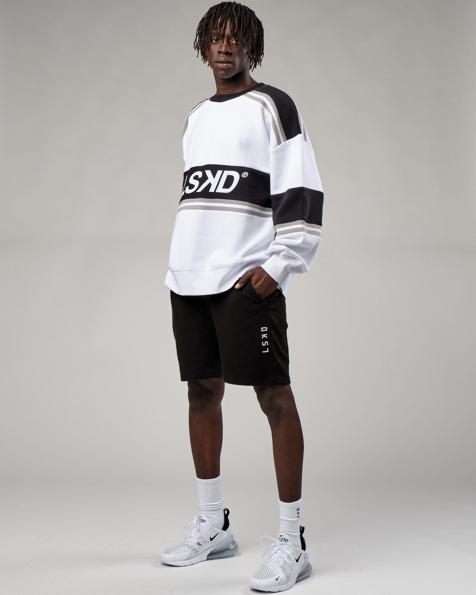 Model wearing Unisex A-Team Sweater Oversize - White-Black-Alloy