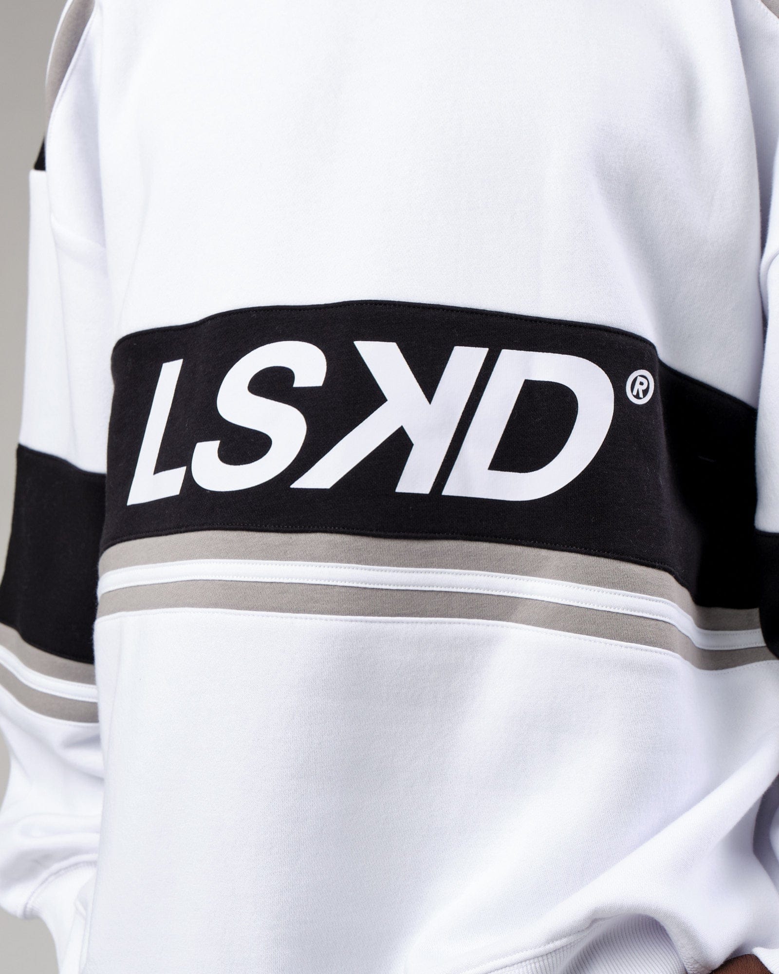 Model wearing Unisex A-Team Sweater Oversize - White-Black-Alloy