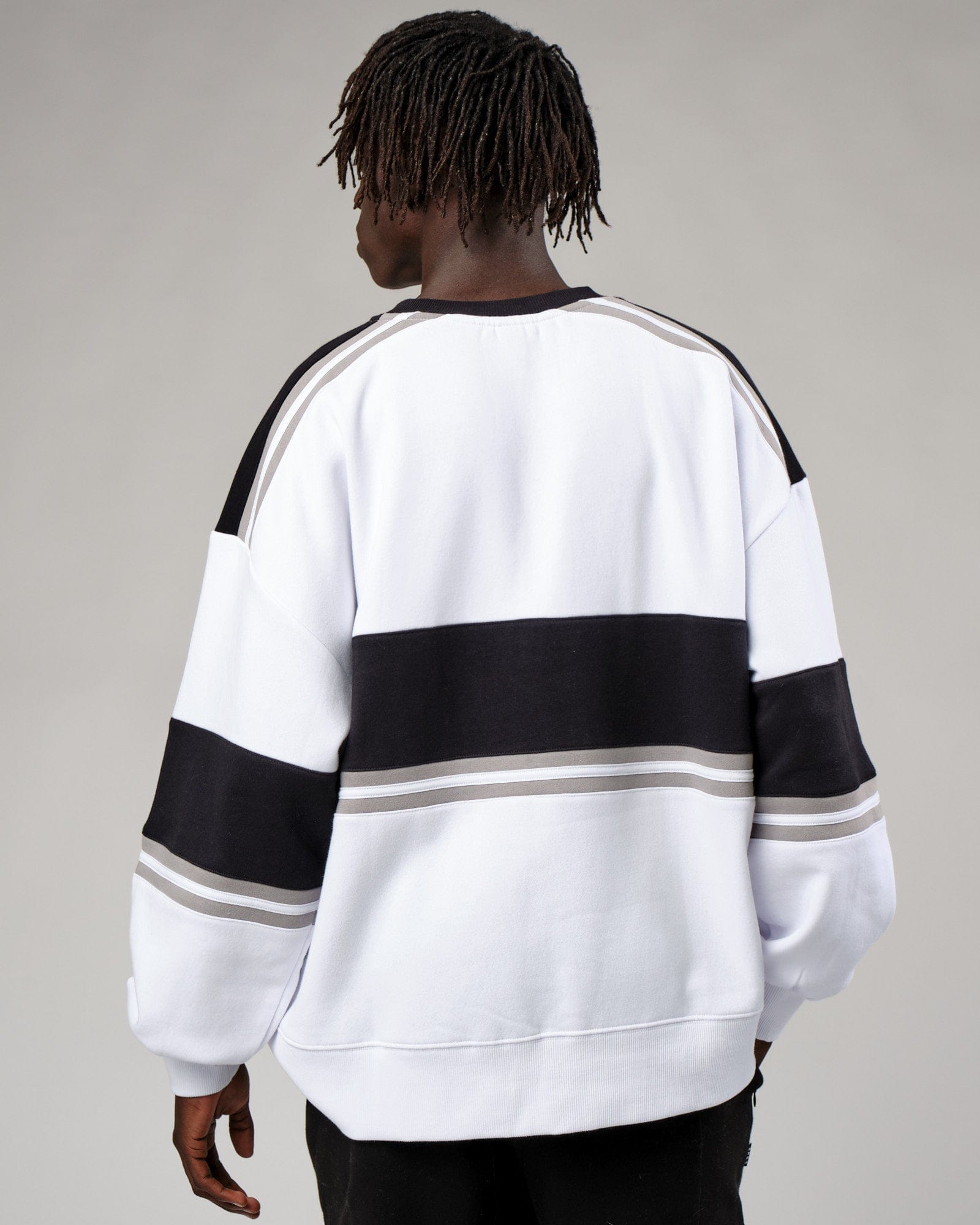 Model wearing Unisex A-Team Sweater Oversize - White-Black-Alloy