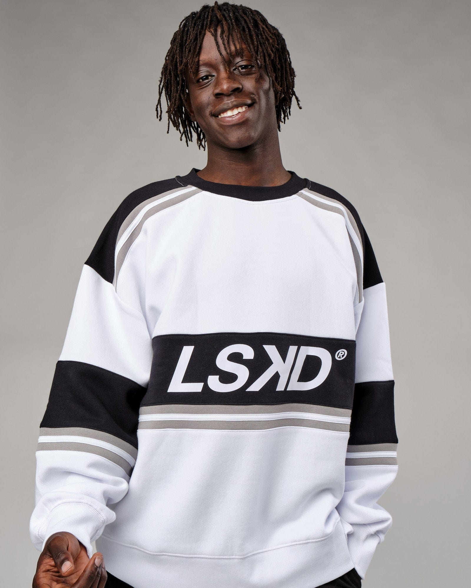 Model wearing Unisex A-Team Sweater Oversize - White-Black-Alloy