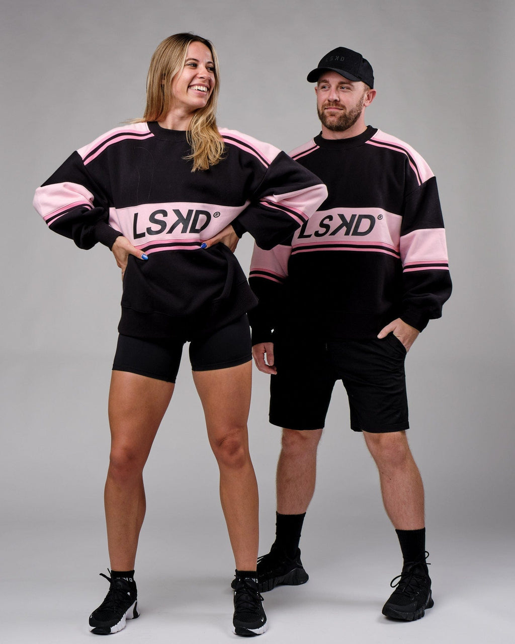 Model wearing Unisex A-Team Sweater Oversize - Black-Petal Pink