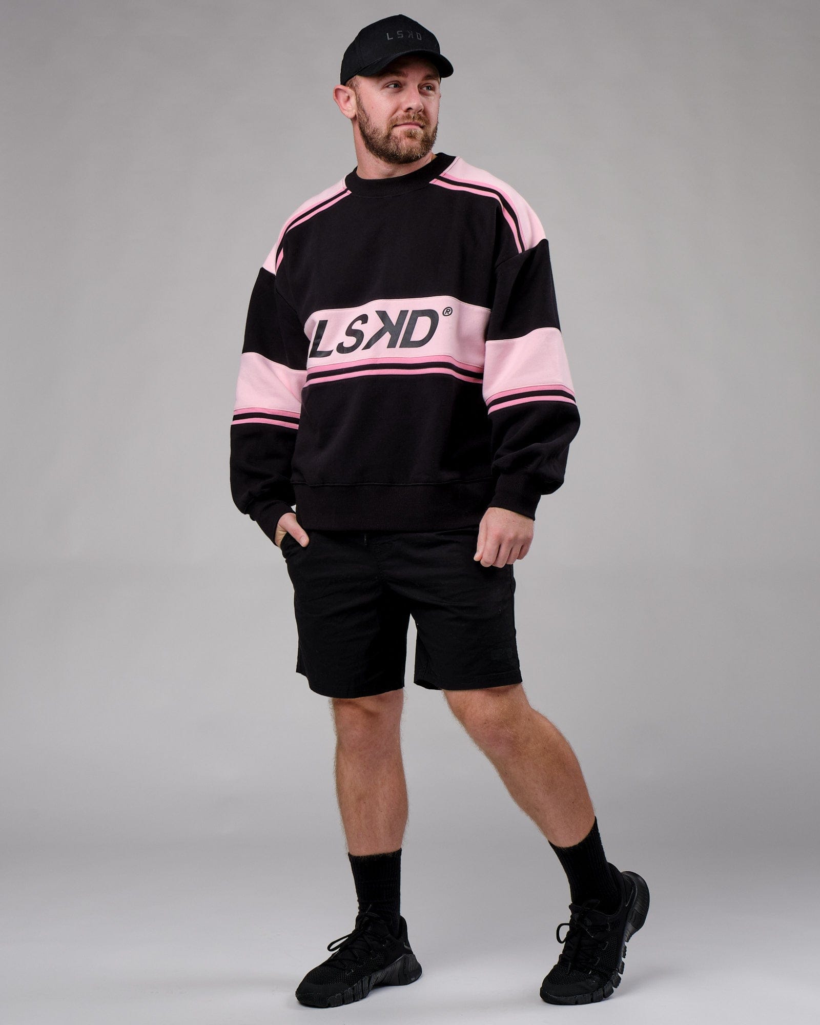 Model wearing Unisex A-Team Sweater Oversize - Black-Petal Pink