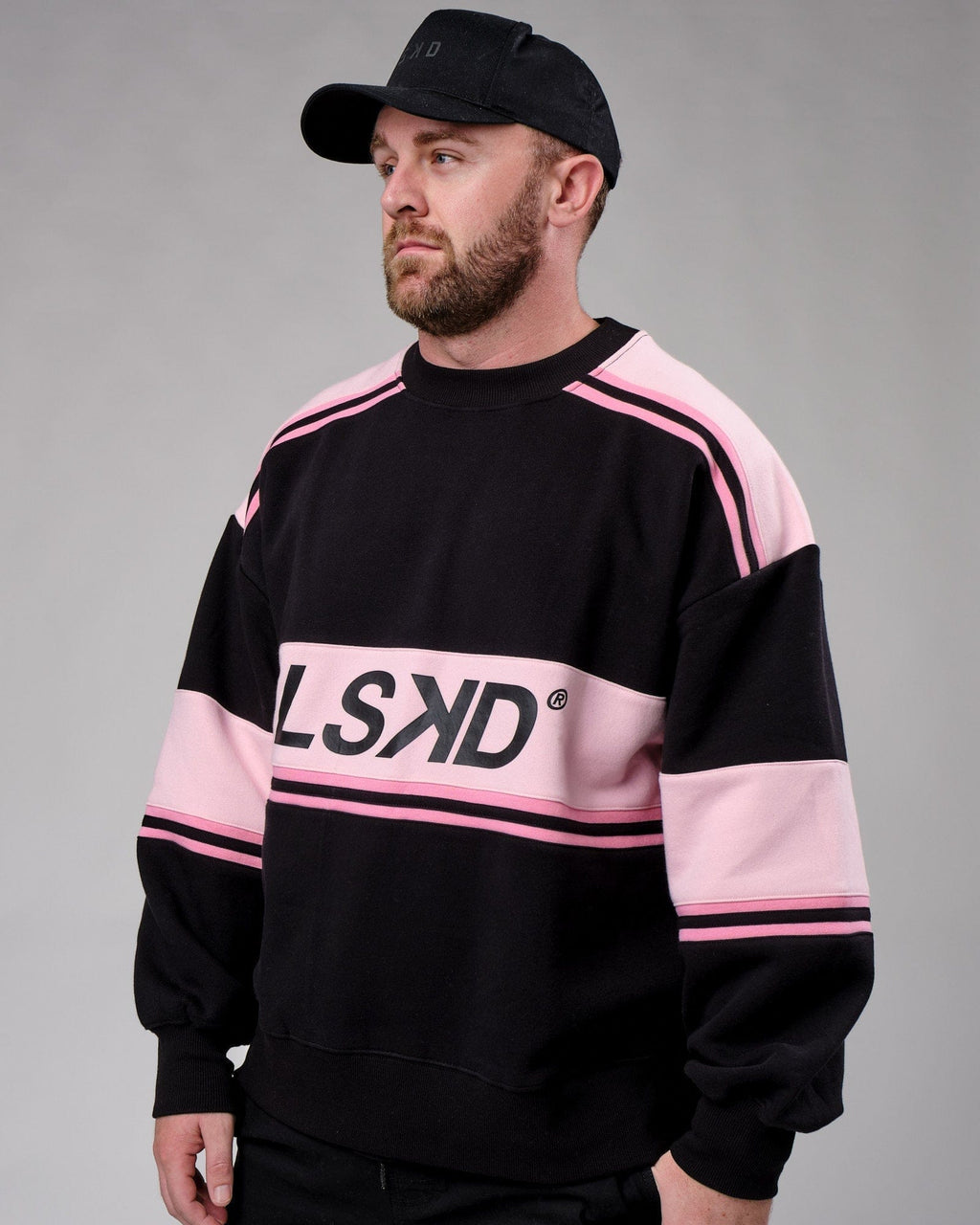 Model wearing Unisex A-Team Sweater Oversize - Black-Petal Pink