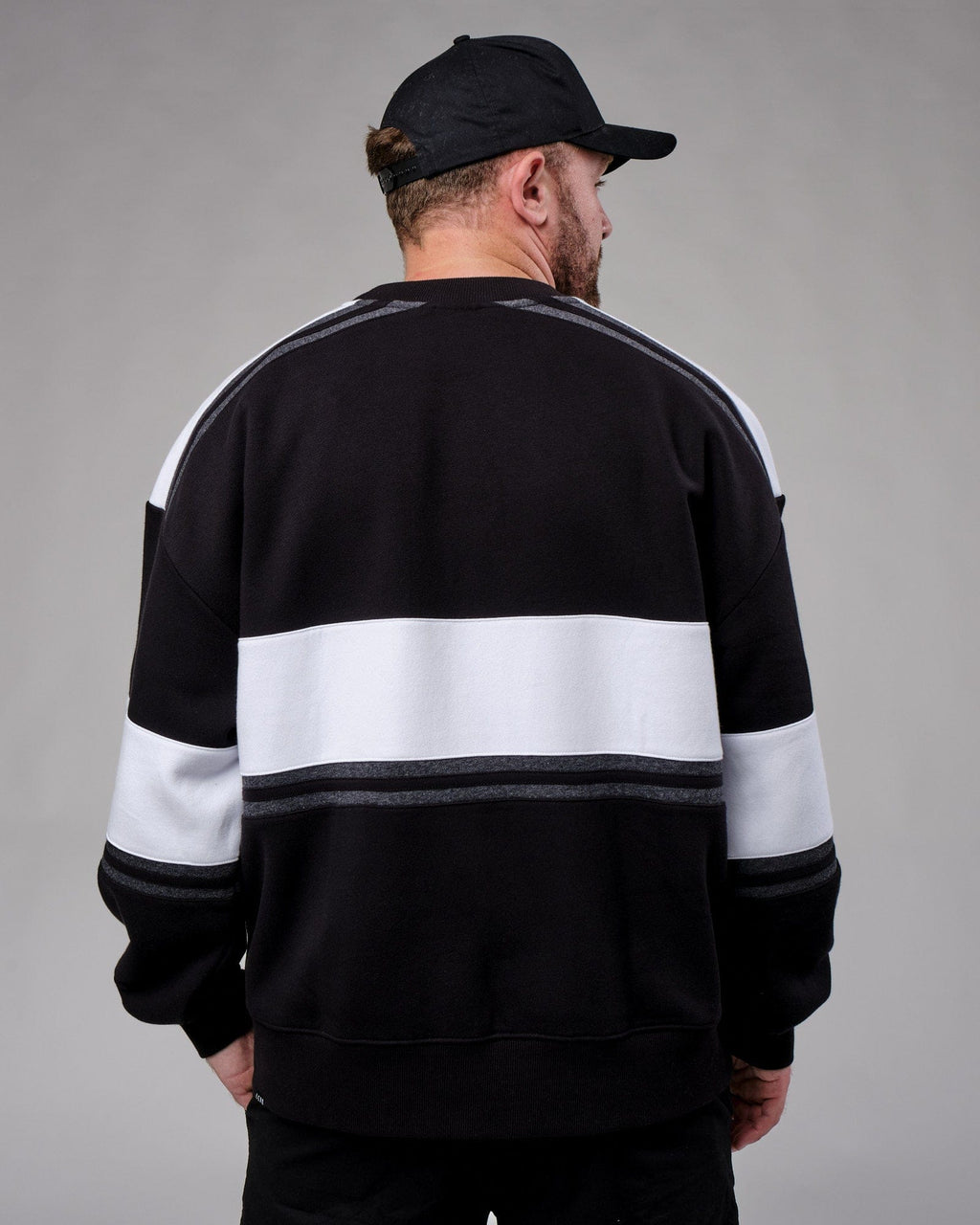 Model wearing Unisex A-Team Sweater Oversize - Black-White