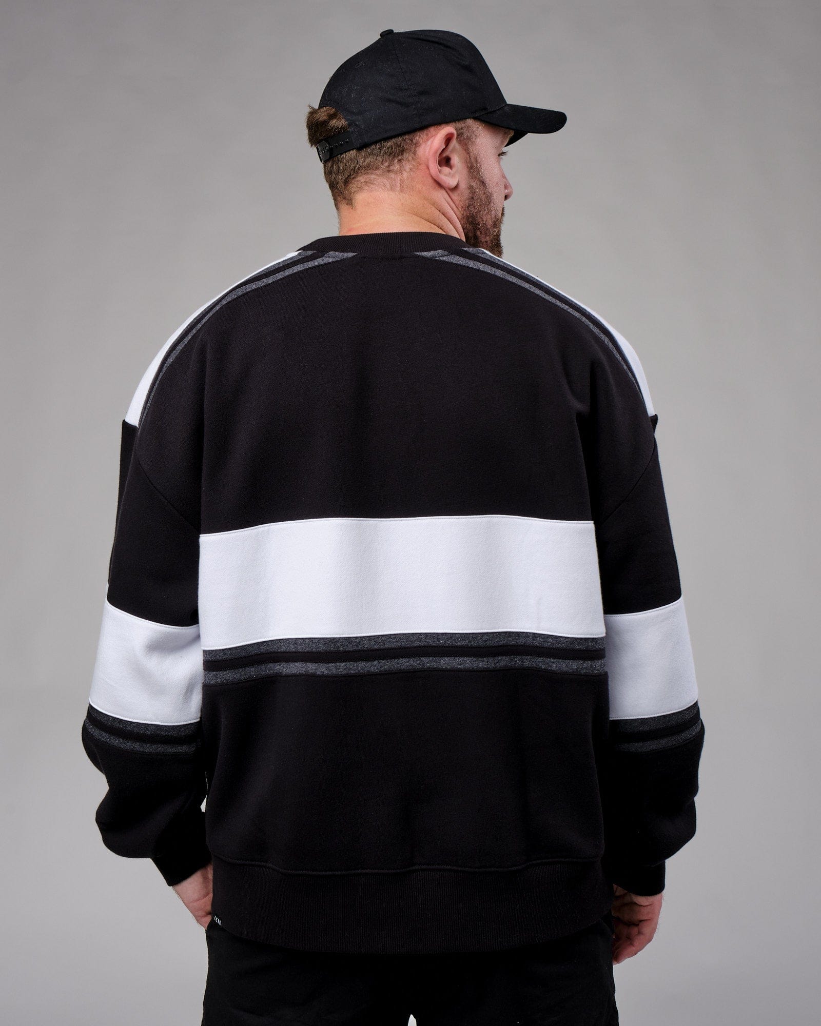Model wearing Unisex A-Team Sweater Oversize - Black-White