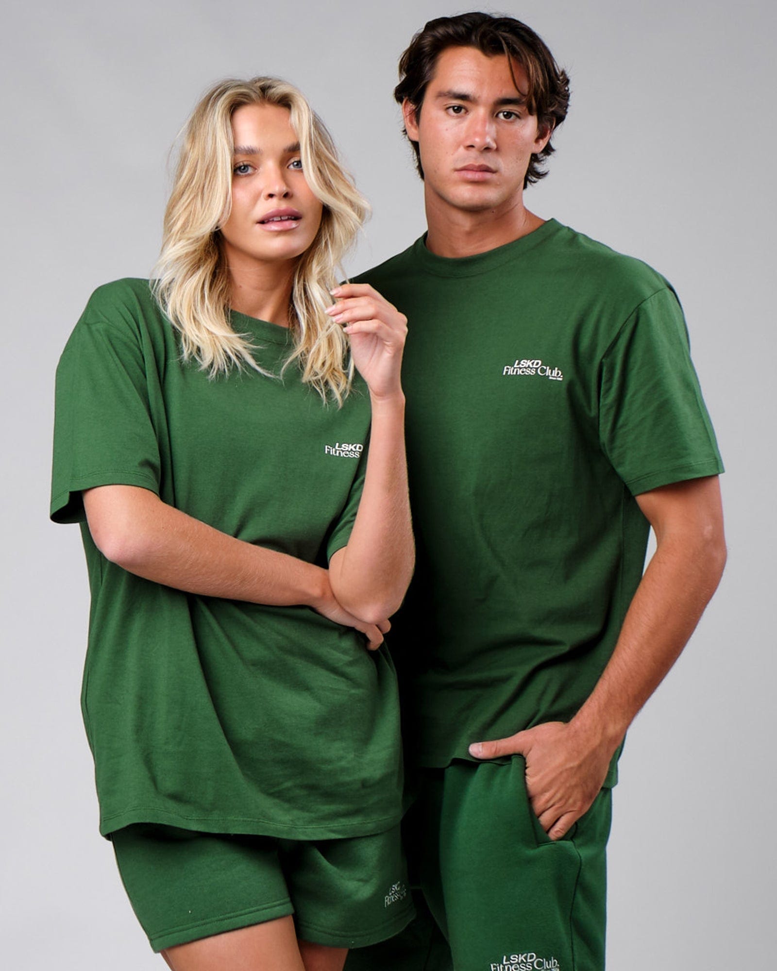 Model wearing Unisex Uplift Tee Oversize - Eden Green