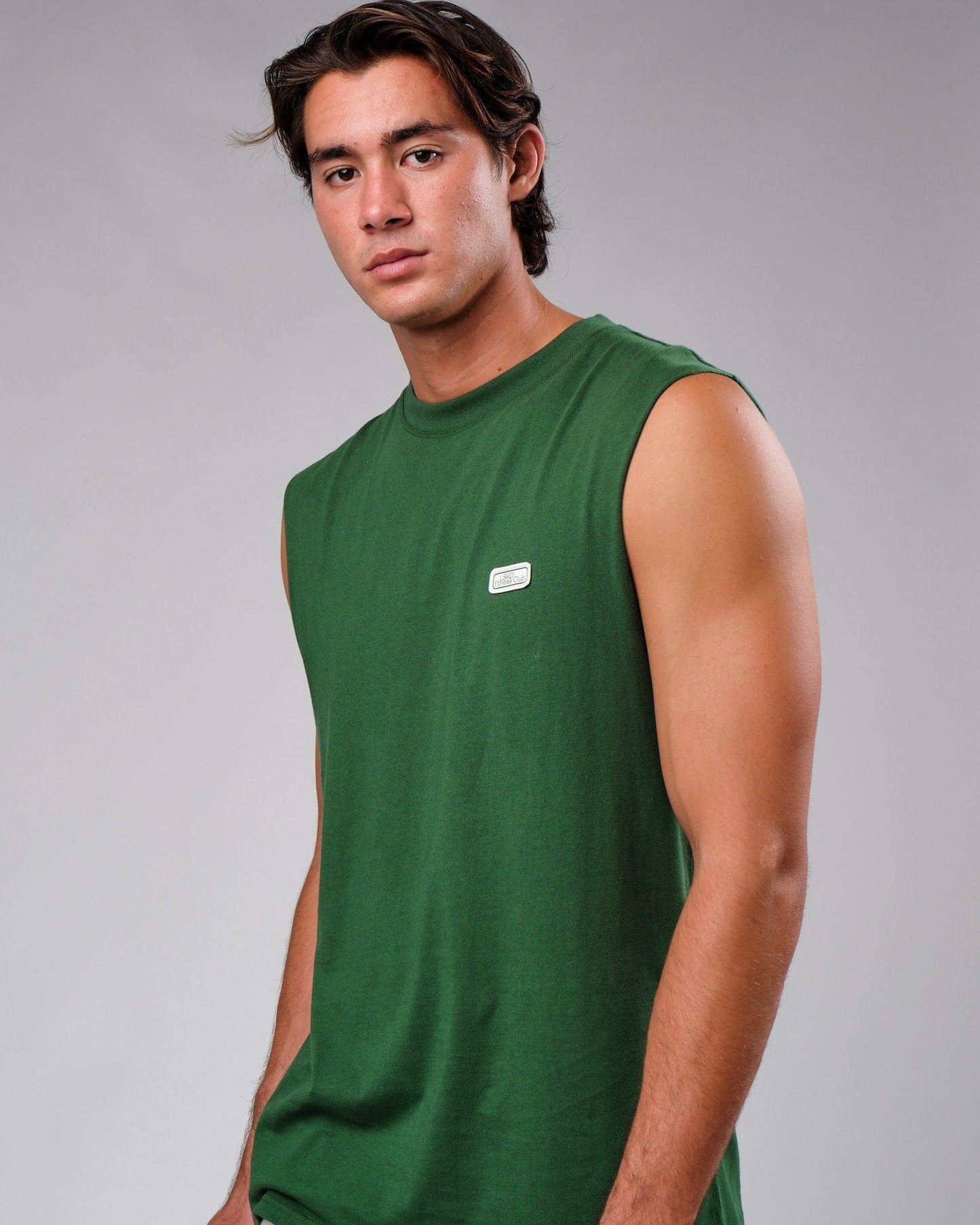 Model wearing Badge Tank Oversize - Eden Green