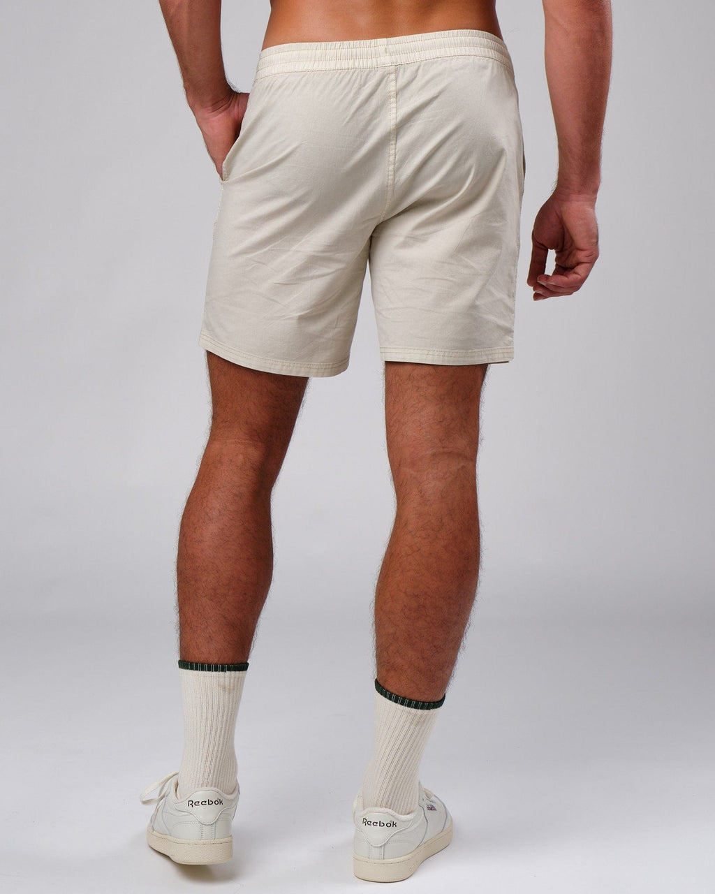 Model wearing Badge Short - Washed Cream