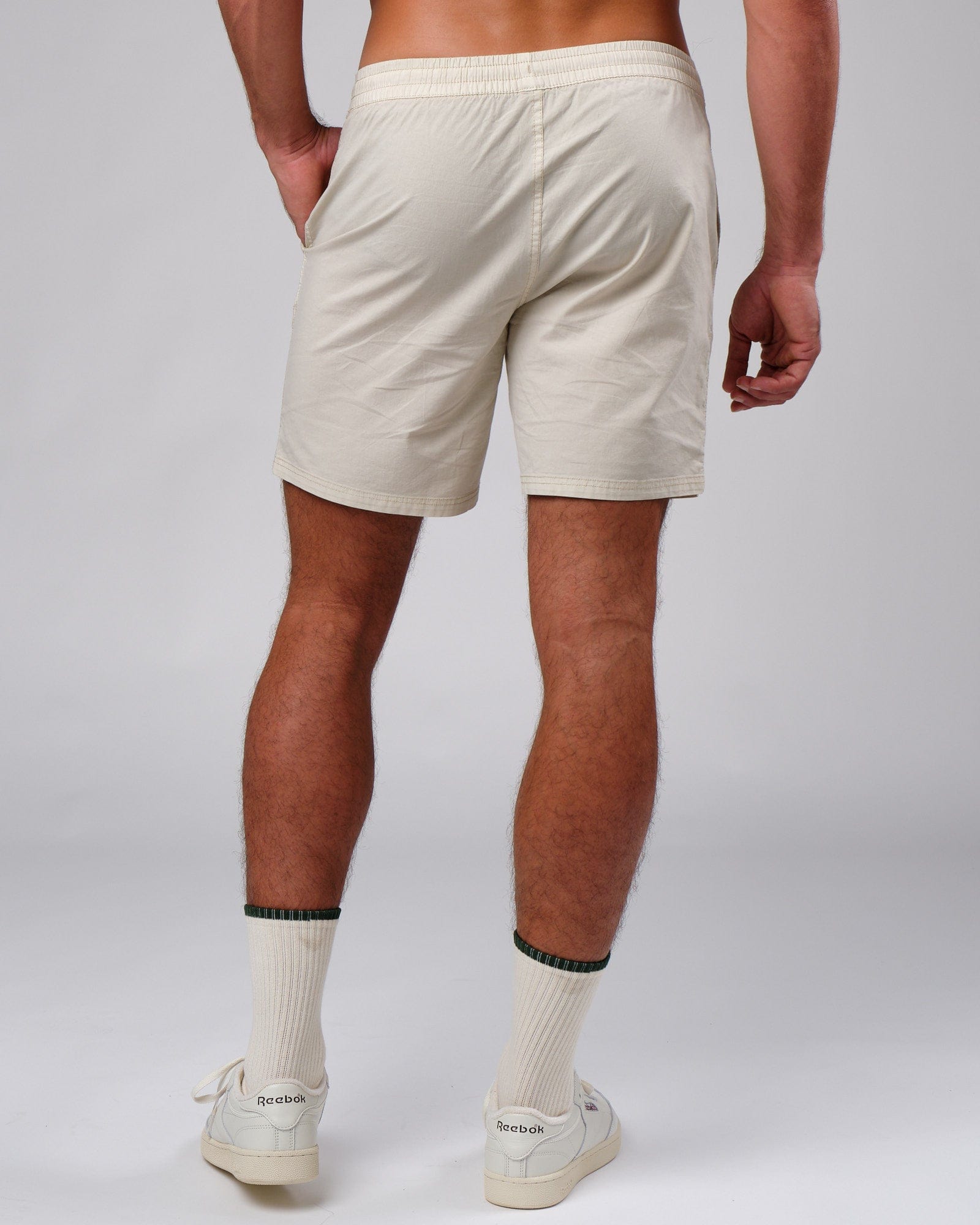 Model wearing Badge Short - Washed Cream