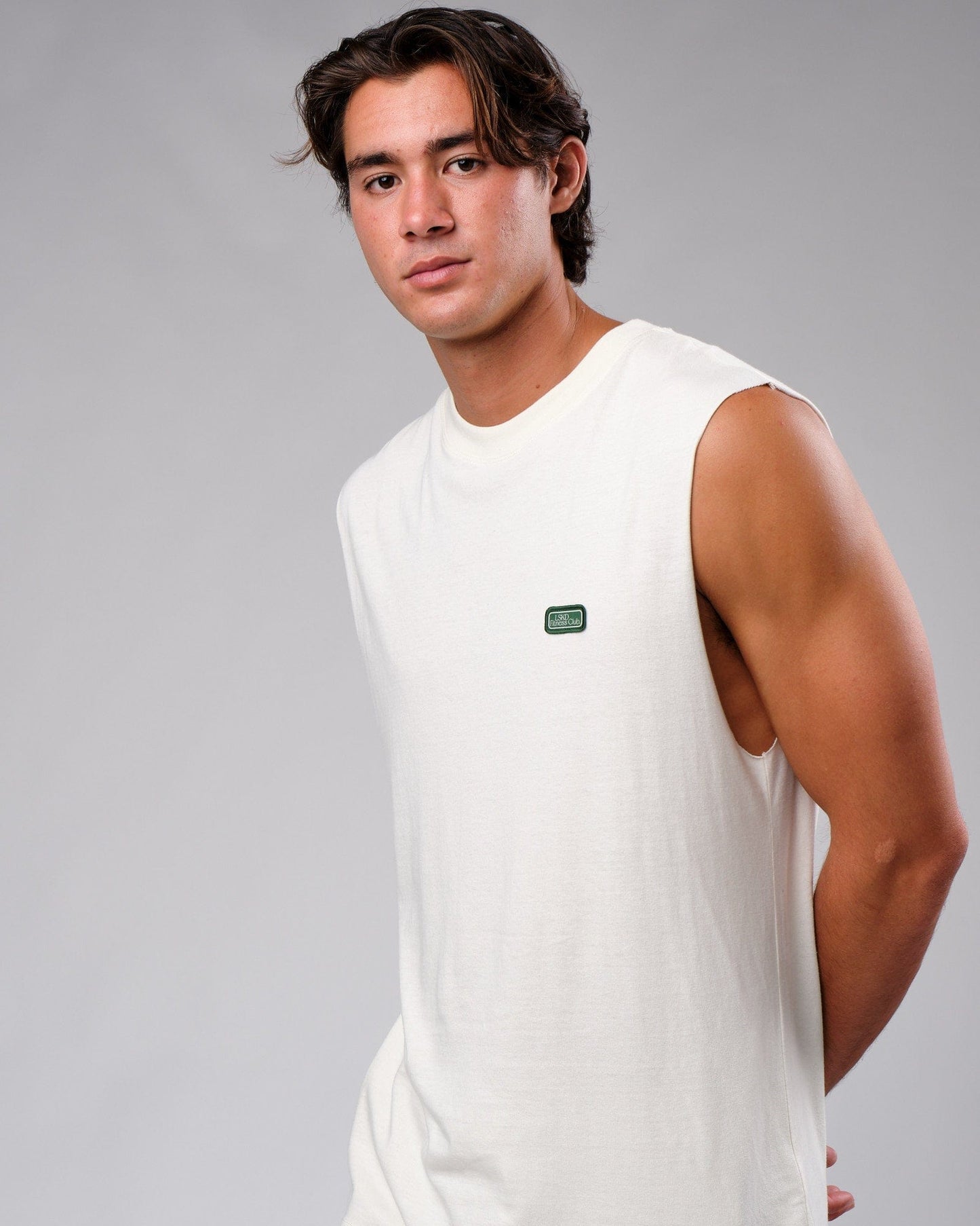 Model wearing Badge Tank Oversize - Cream