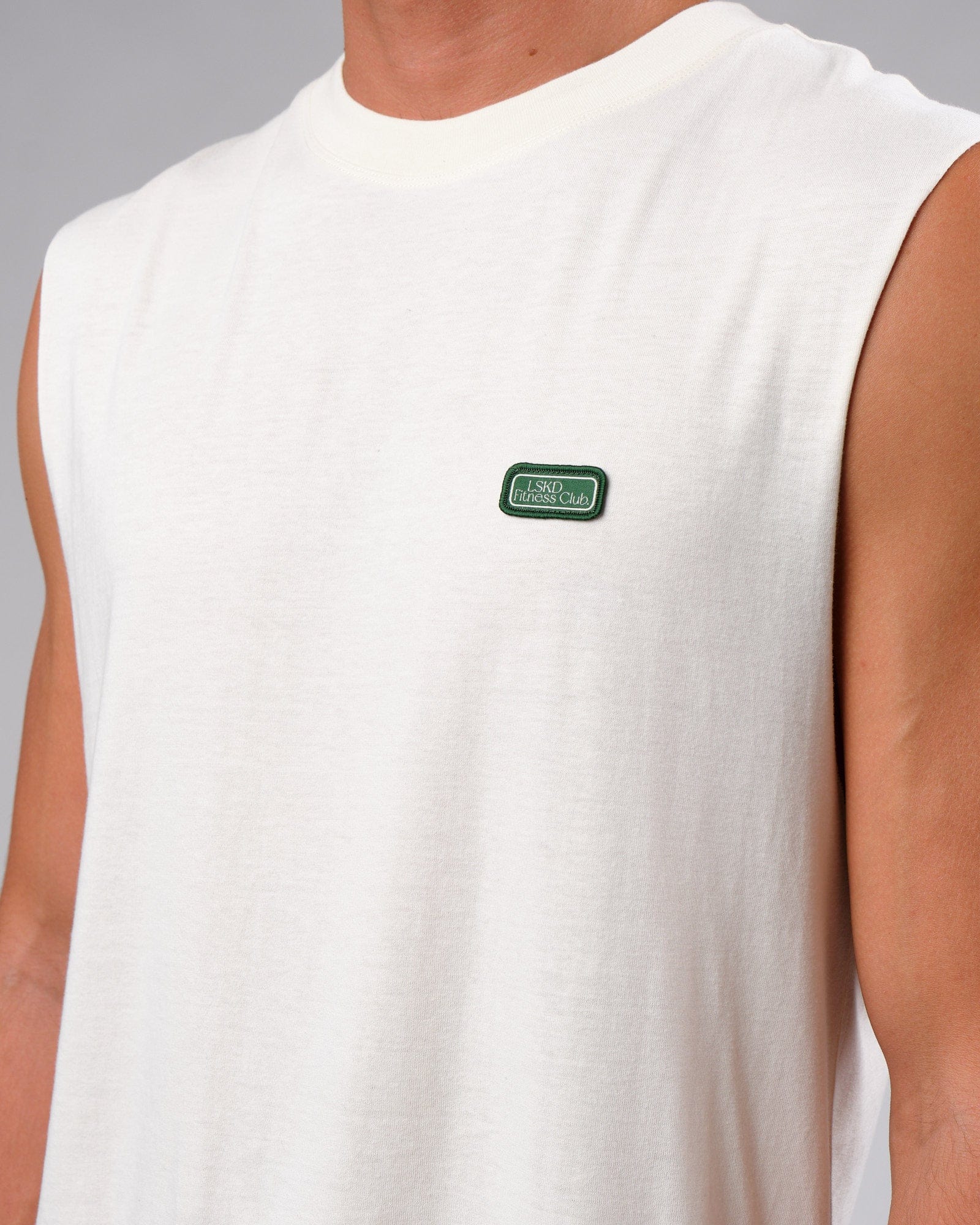 Model wearing Badge Tank Oversize - Cream