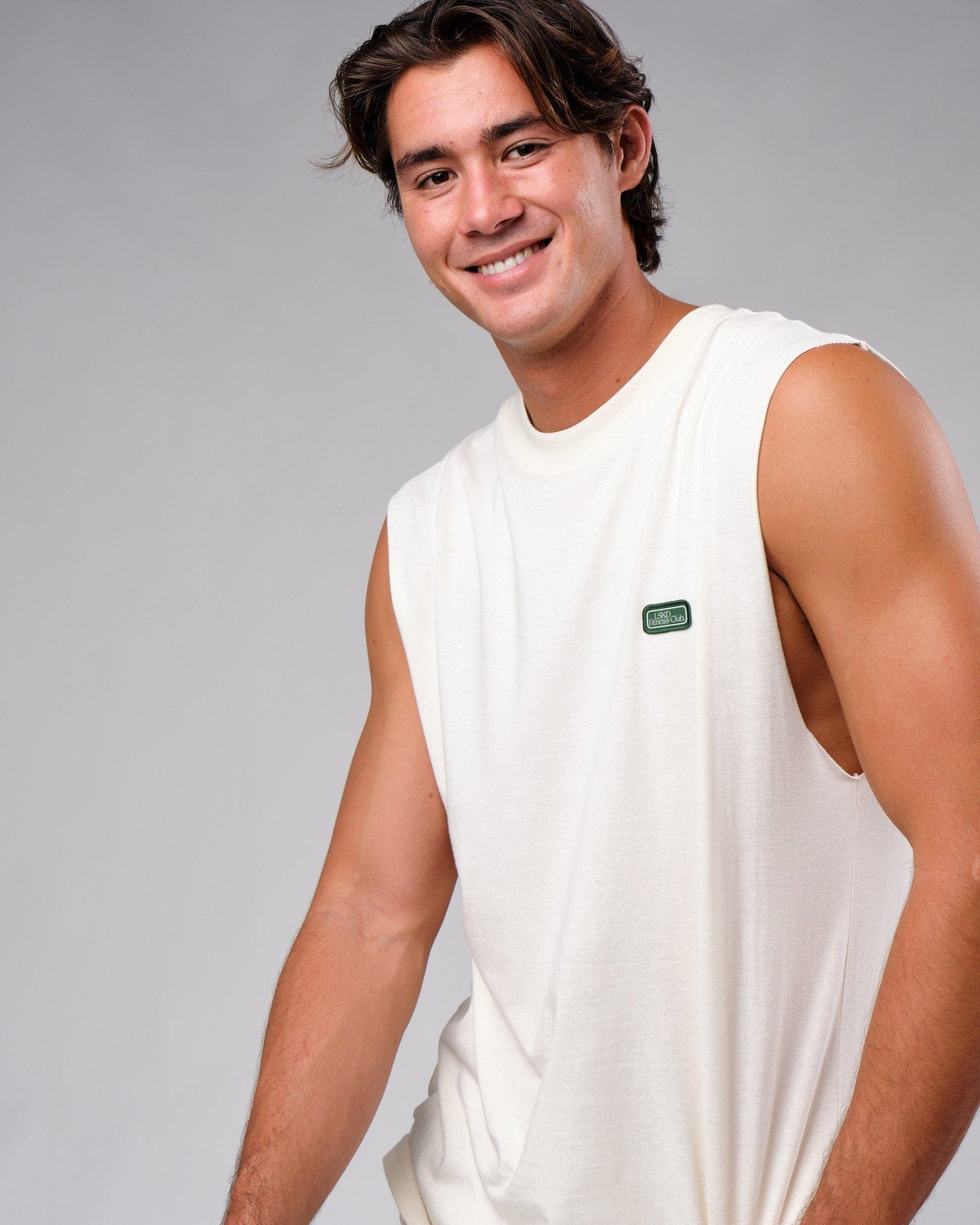 Model wearing Badge Tank Oversize - Cream