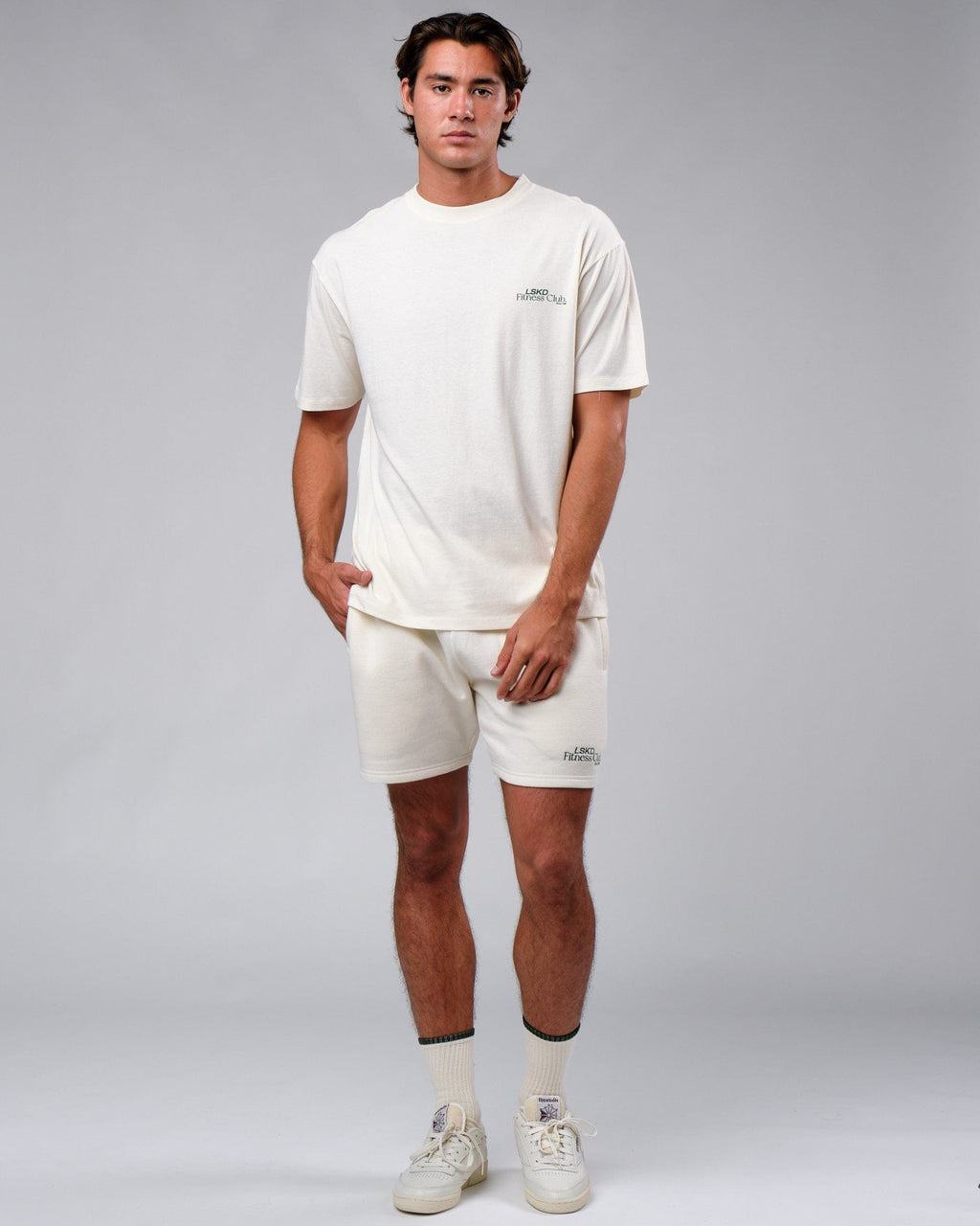 Model wearing Clubhouse Track Short - Cream