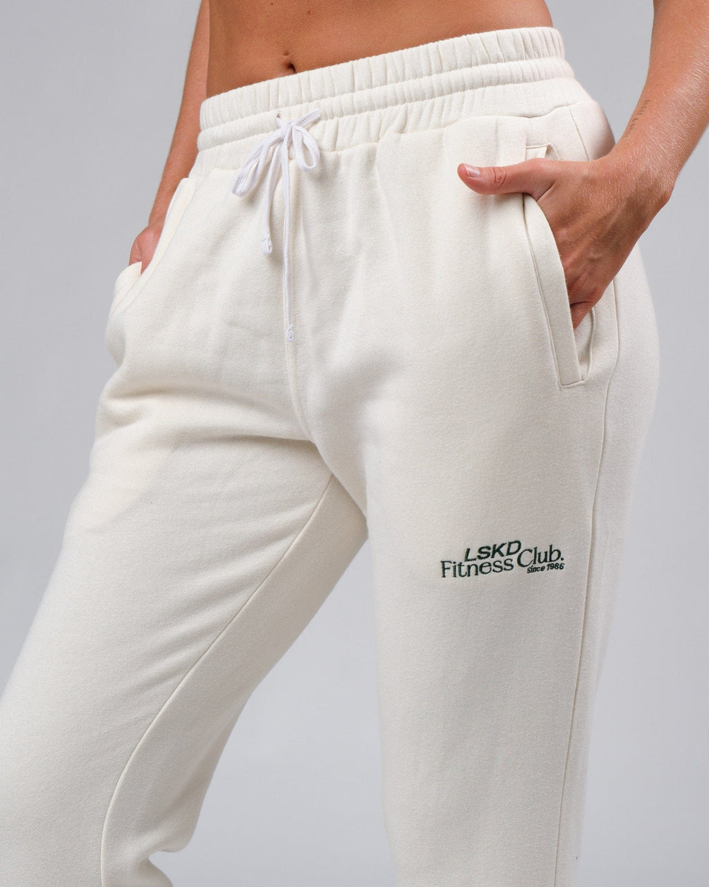 Model wearing Unisex Clubhouse Track Pant - Cream