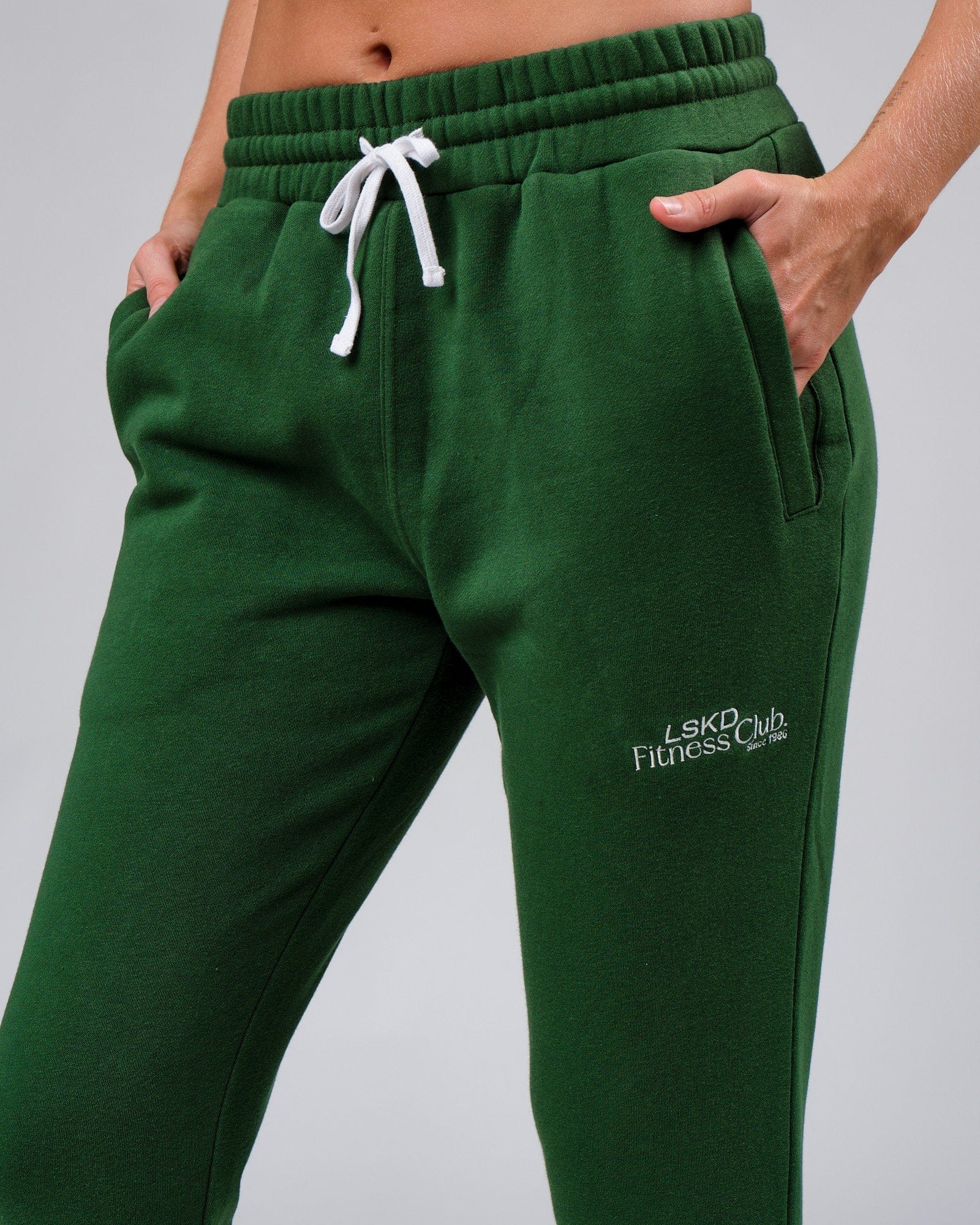 Model wearing Unisex Clubhouse Track Pant - Eden Green