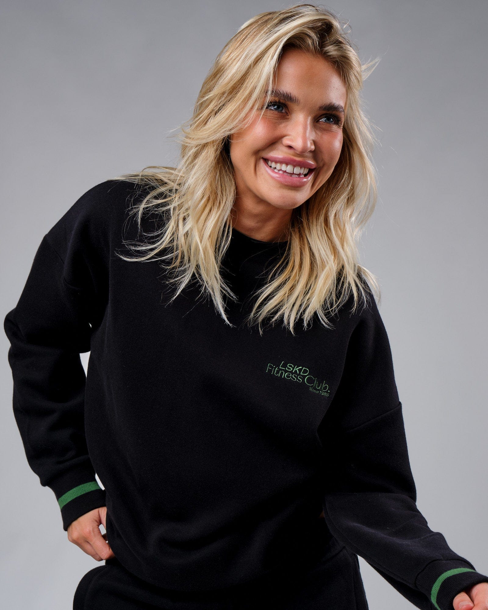Model wearing Unisex Clubhouse Sweater Oversize - Black