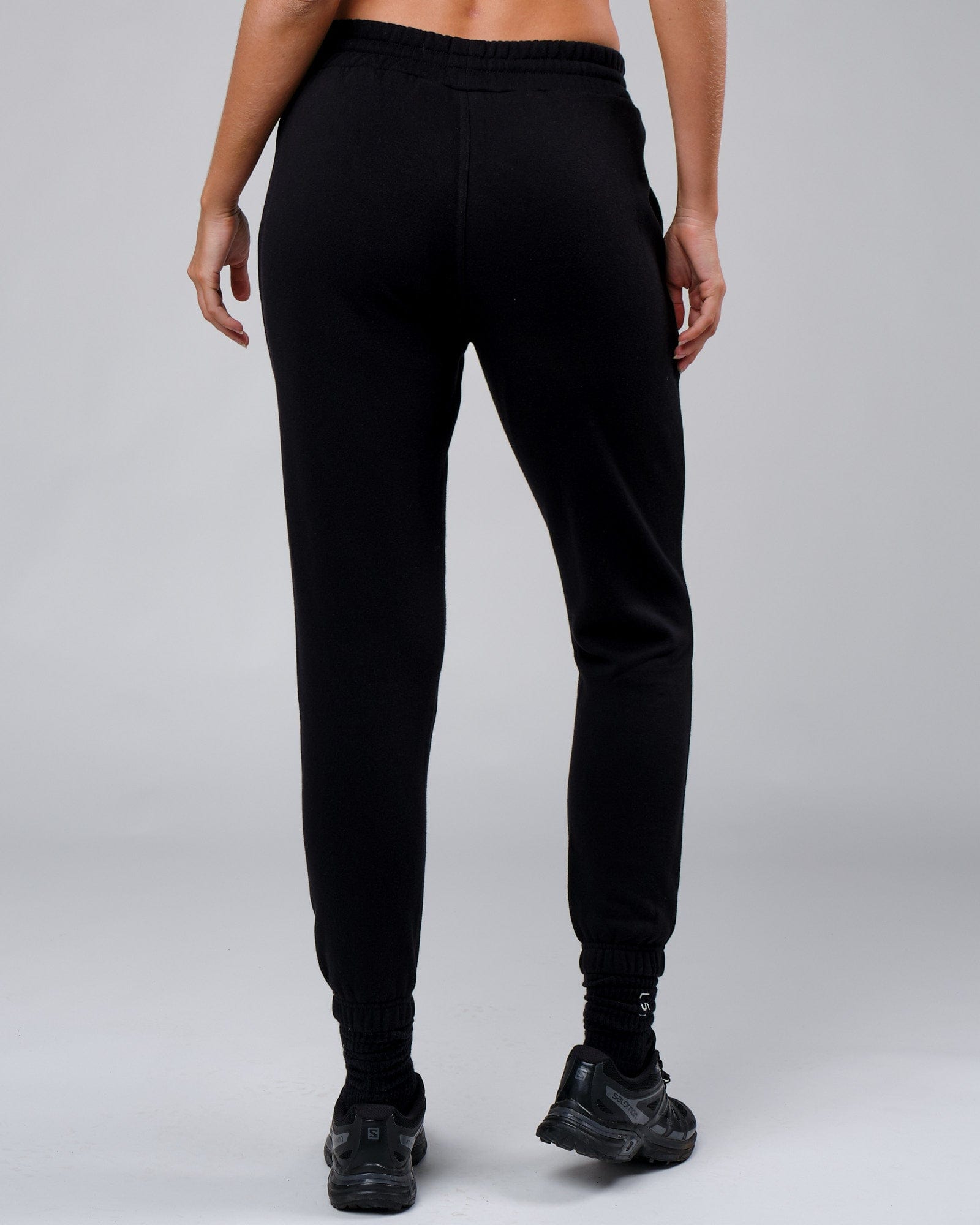 Model wearing Unisex Clubhouse Track Pant - Black
