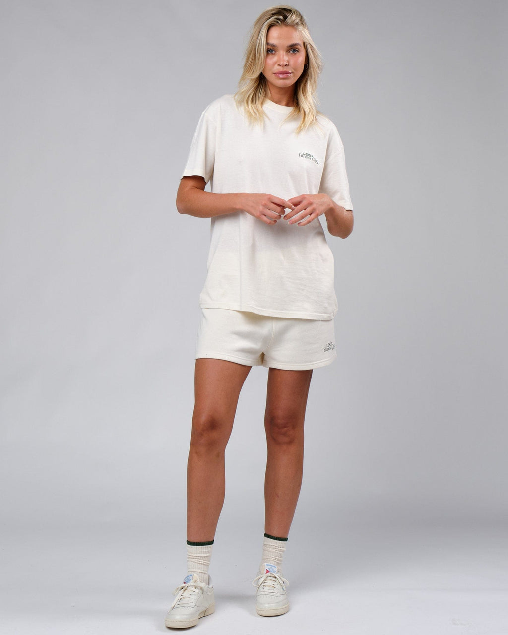 Model wearing Unisex Uplift Tee Oversize - Cream