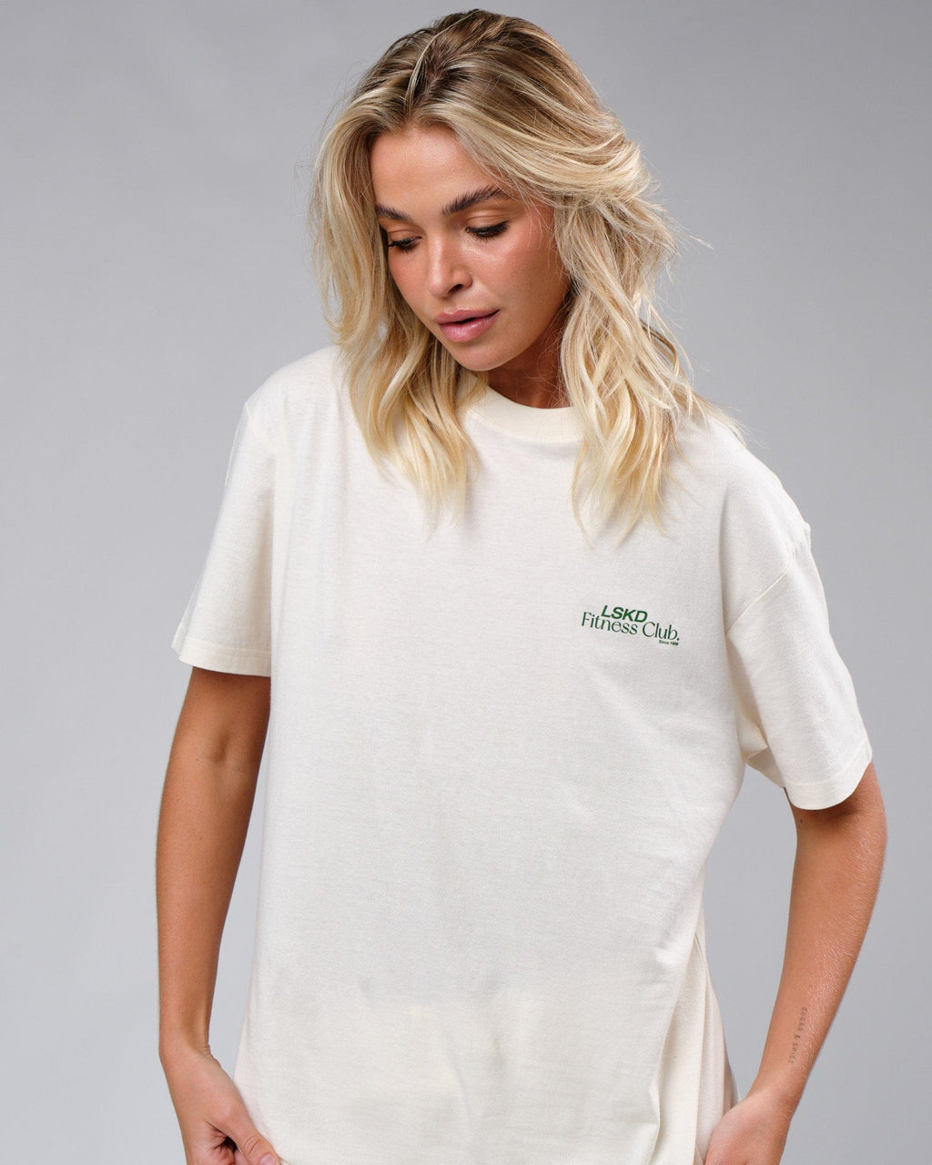 Model wearing Unisex Uplift Tee Oversize - Cream