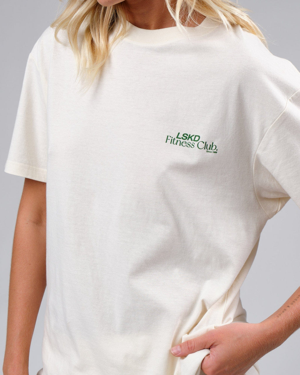 Model wearing Unisex Uplift Tee Oversize - Cream