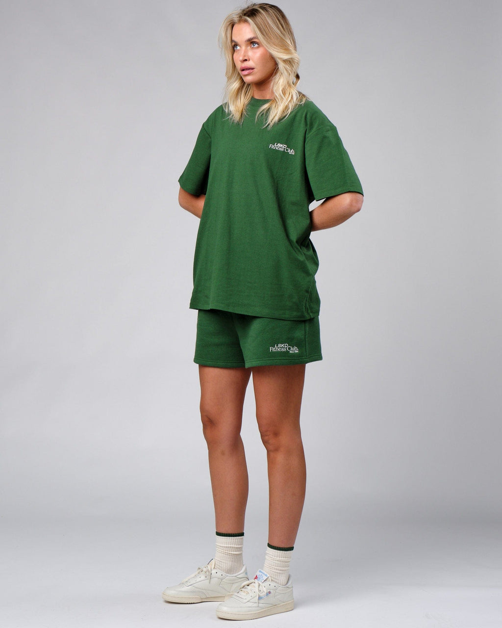 Model wearing Unisex Uplift Tee Oversize - Eden Green