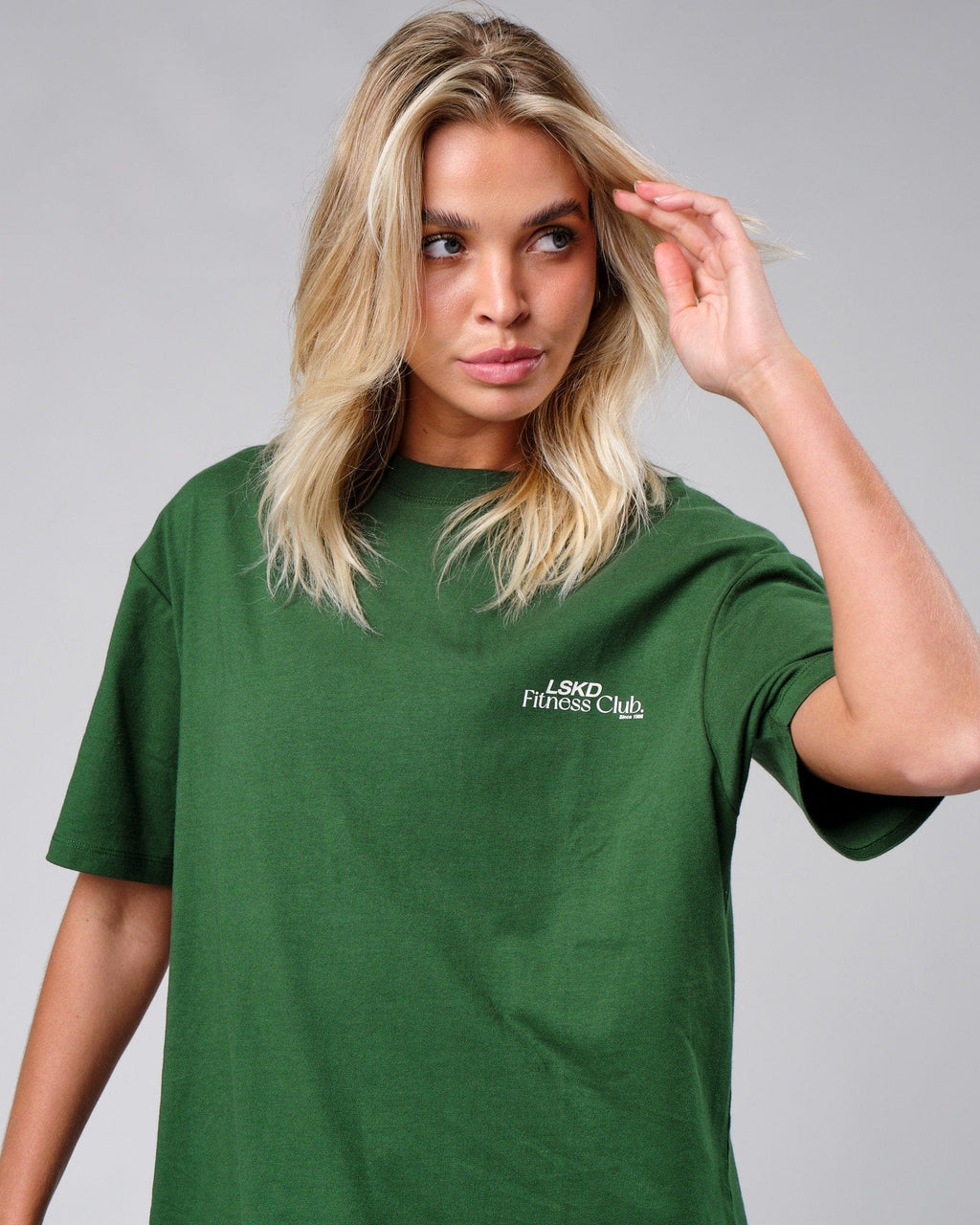Model wearing Unisex Uplift Tee Oversize - Eden Green