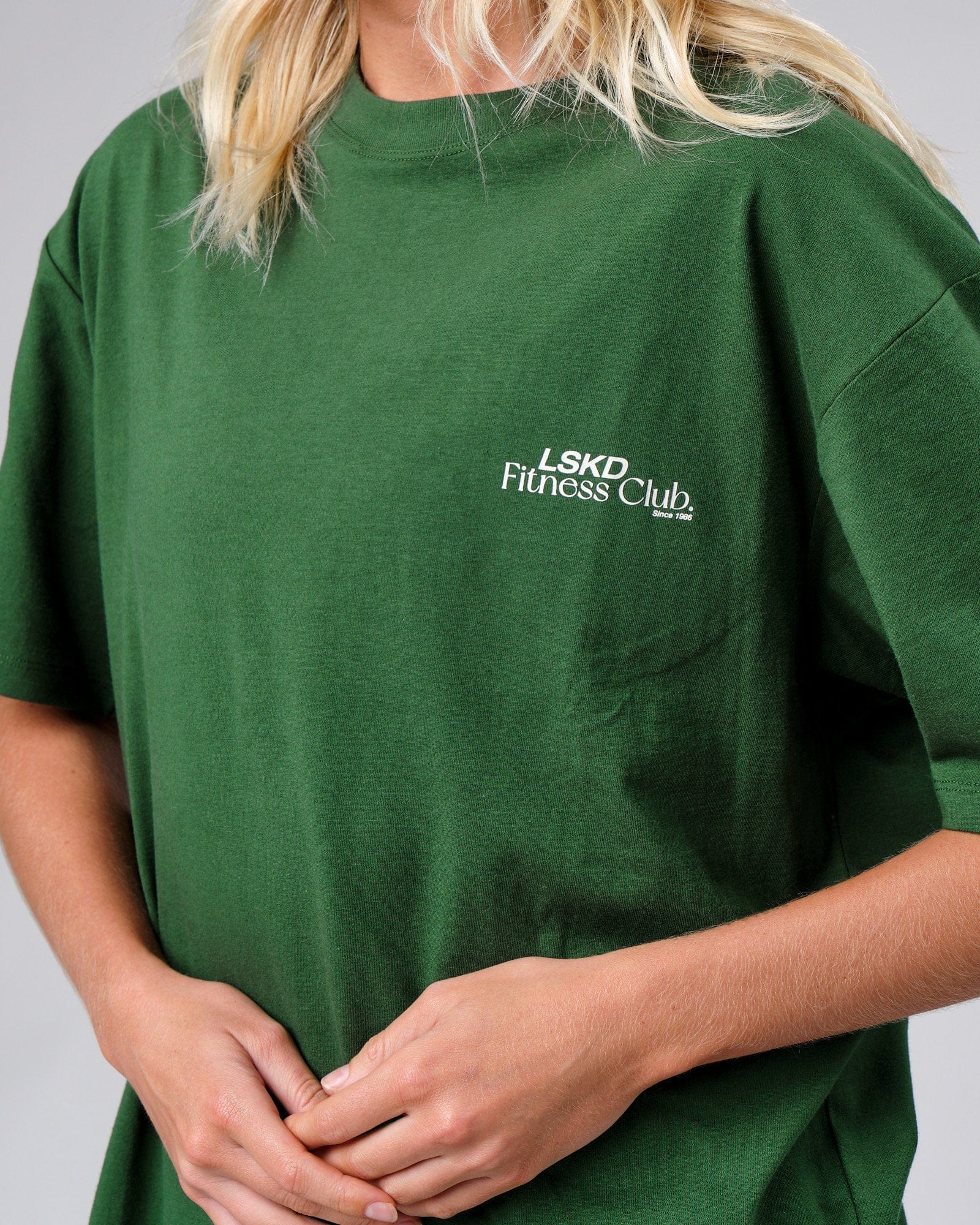 Model wearing Unisex Uplift Tee Oversize - Eden Green