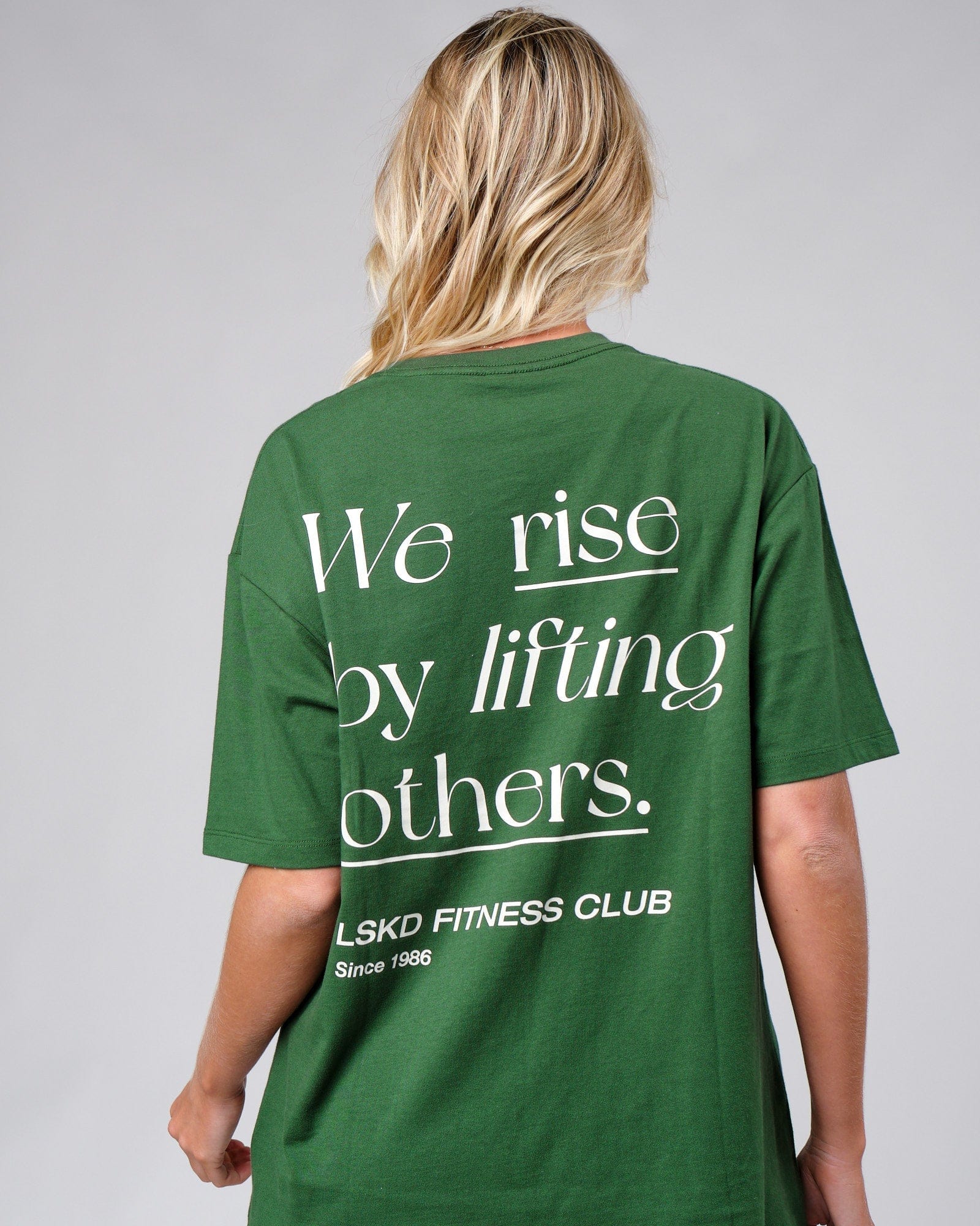 Model wearing Unisex Uplift Tee Oversize - Eden Green