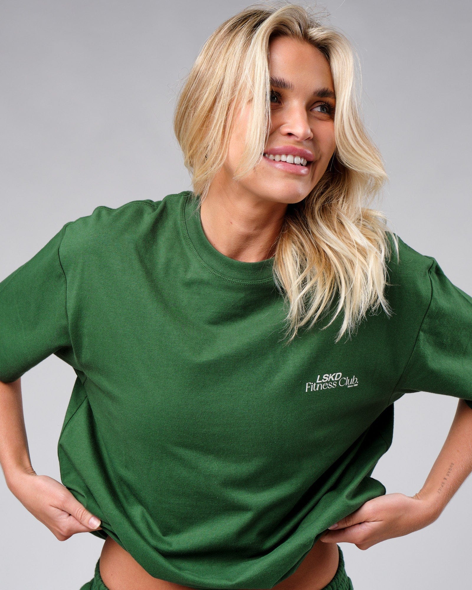 Model wearing Unisex Uplift Tee Oversize - Eden Green