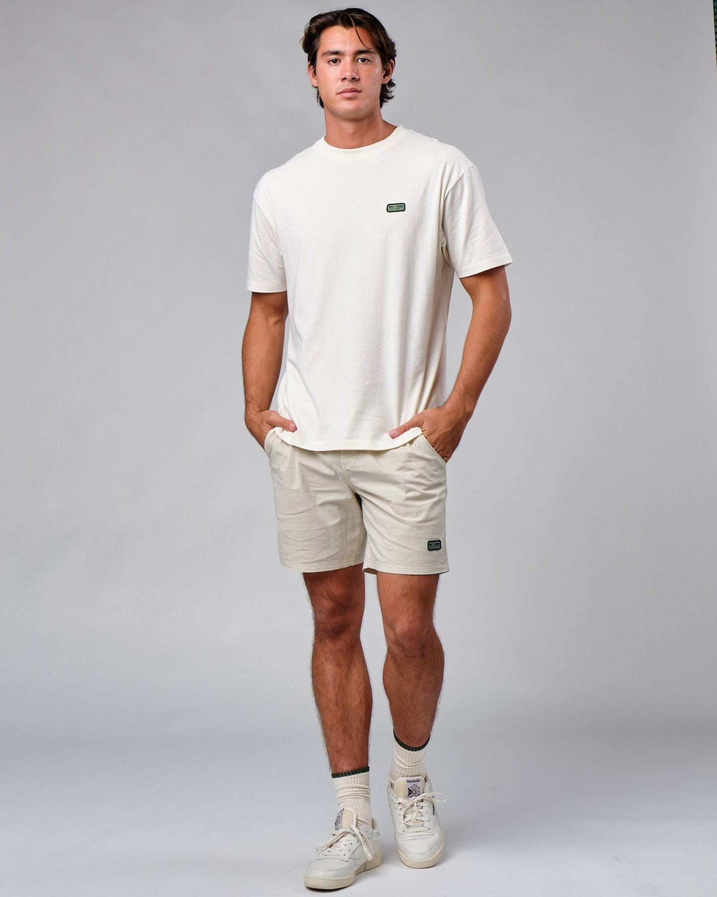 Model wearing Badge Tee Oversize - Cream