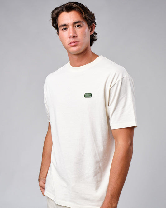 Model wearing Badge Tee Oversize - Cream