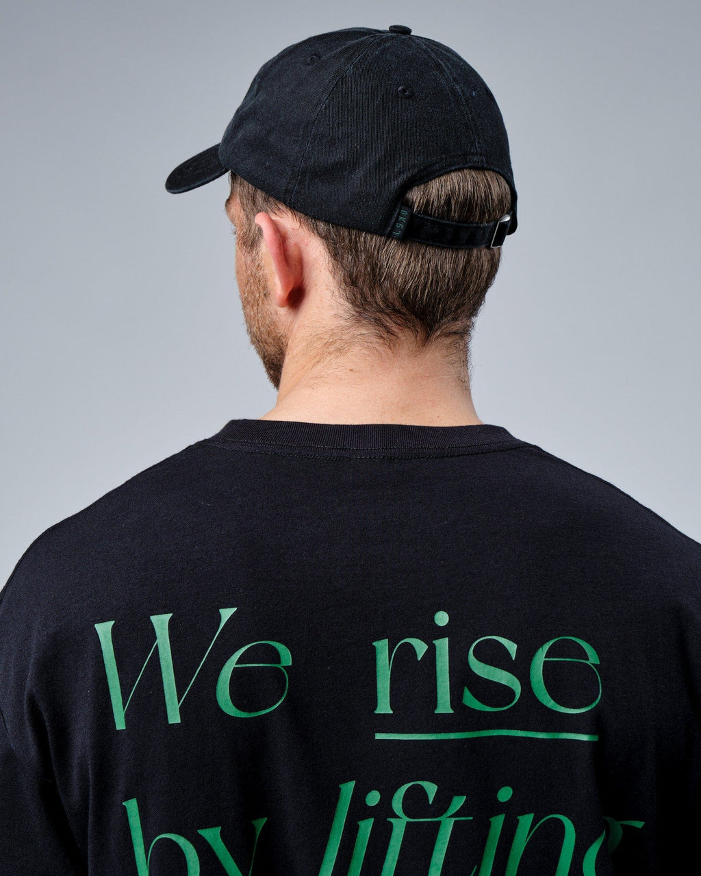 Model wearing Social Cap - Washed Black-Eden Green