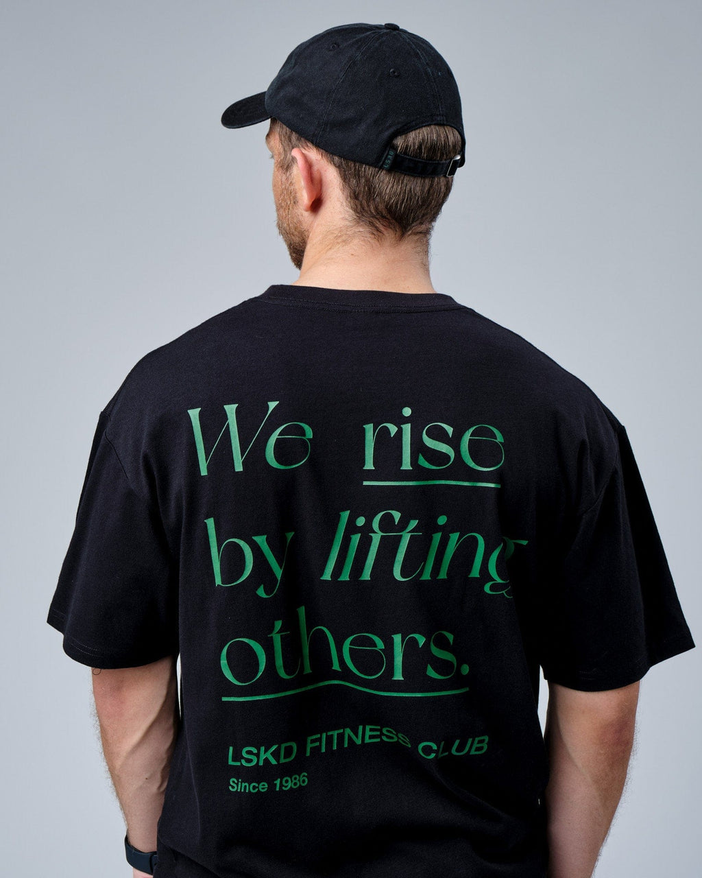 Model wearing Social Cap - Washed Black-Eden Green