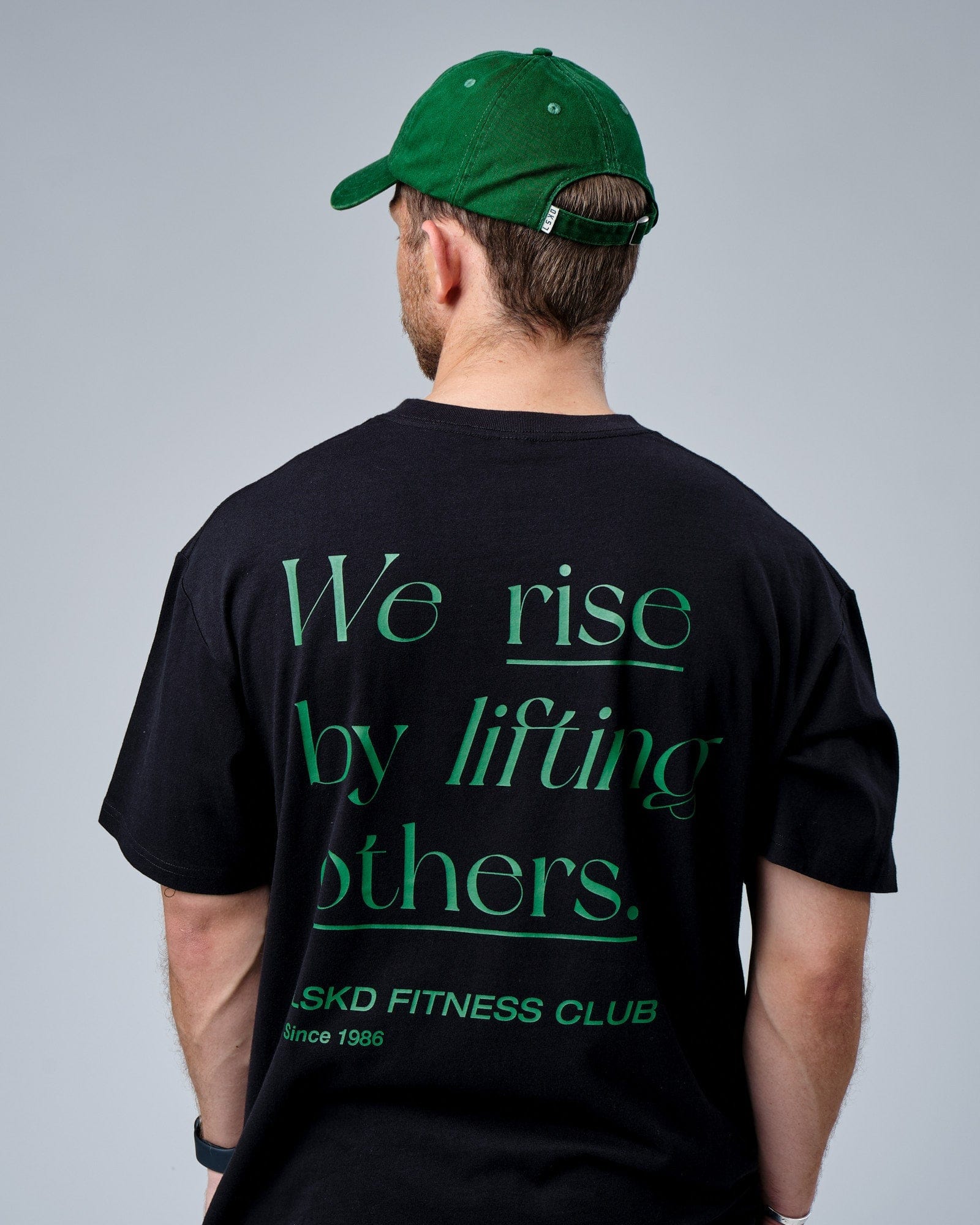 Model wearing Social Cap - Washed Eden Green