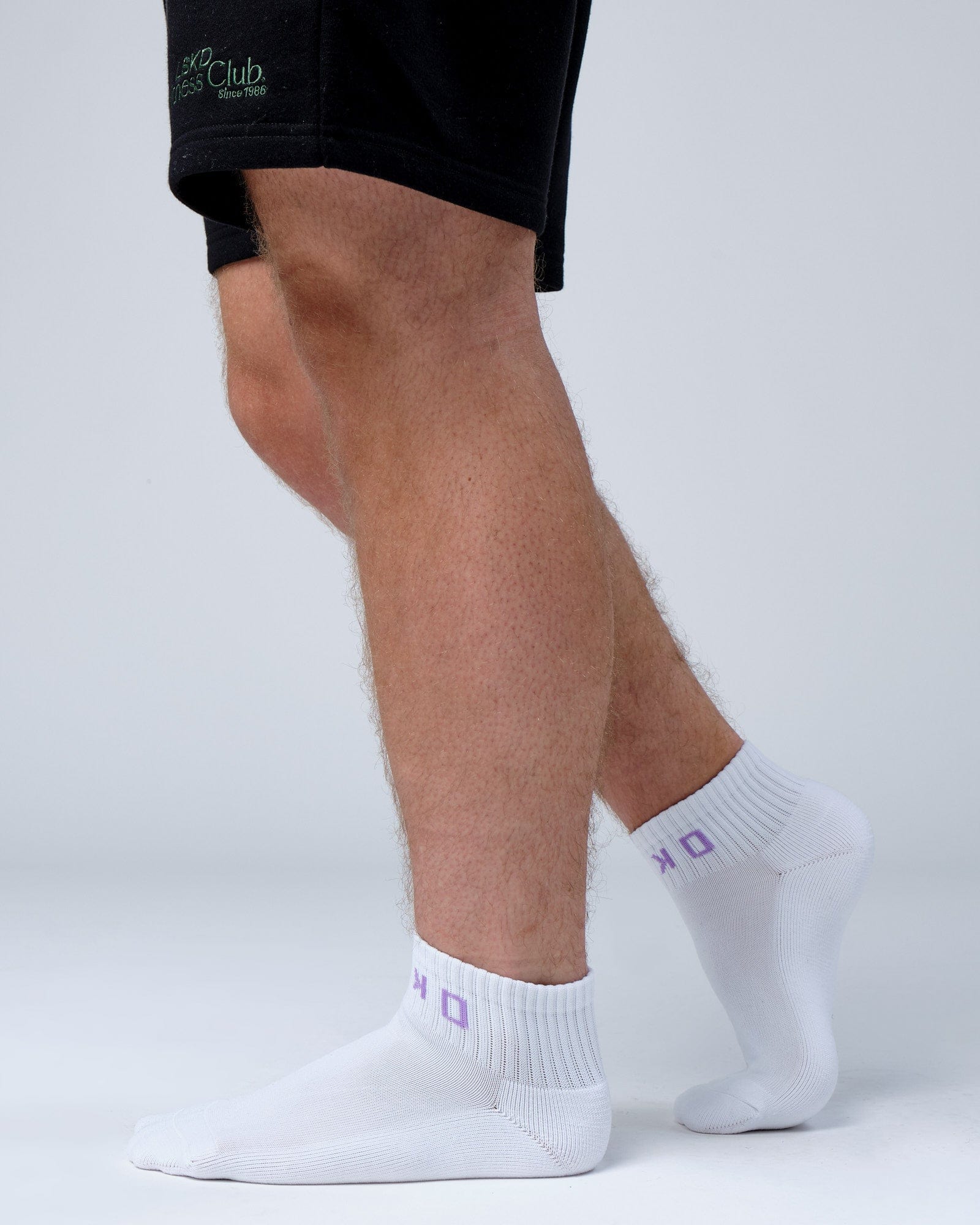 Model wearing Base Quarter Sock - White-Cosmic Sky